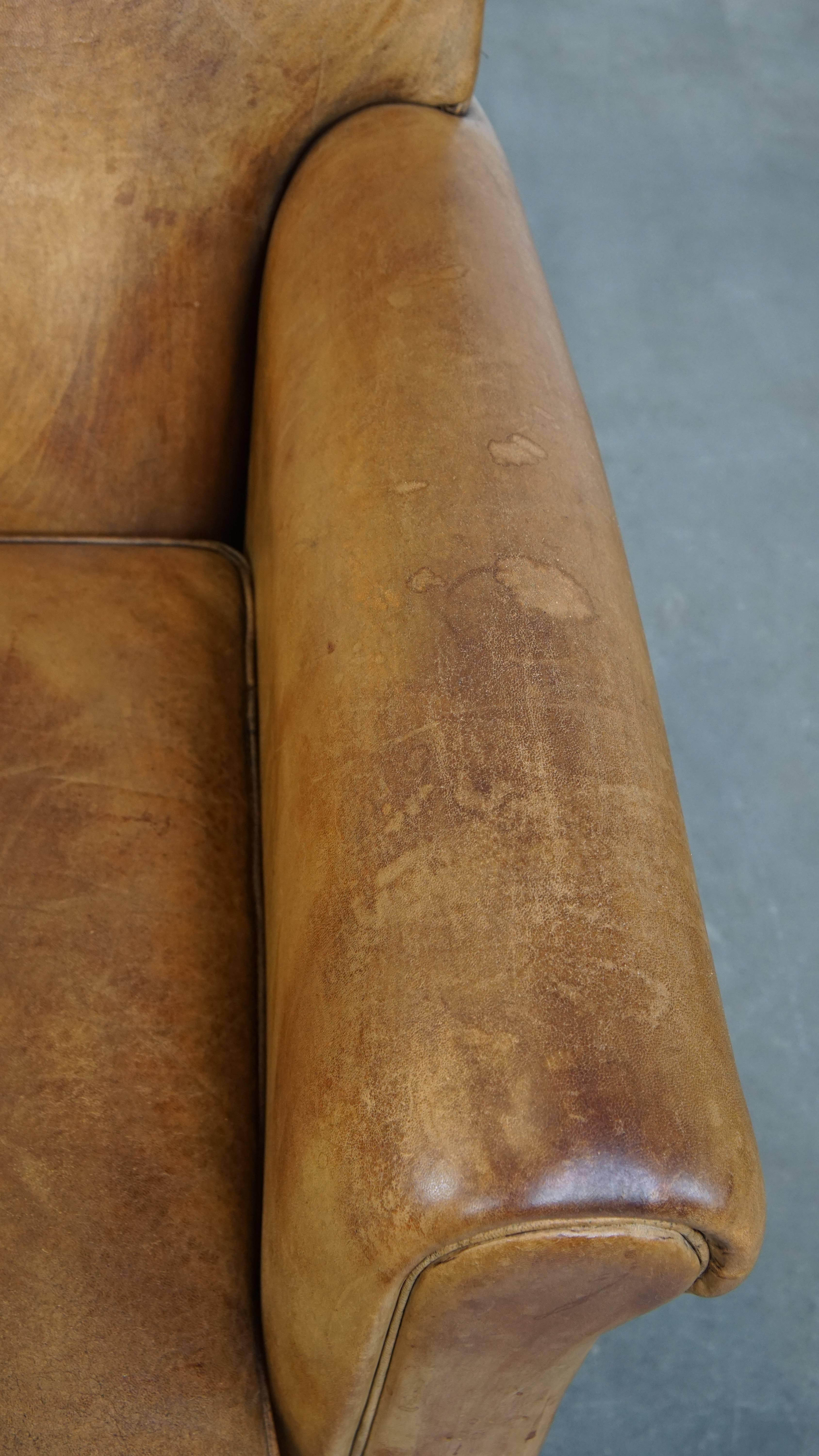 Comfortable and stylish vintage sheepskin leather armchair For Sale 1