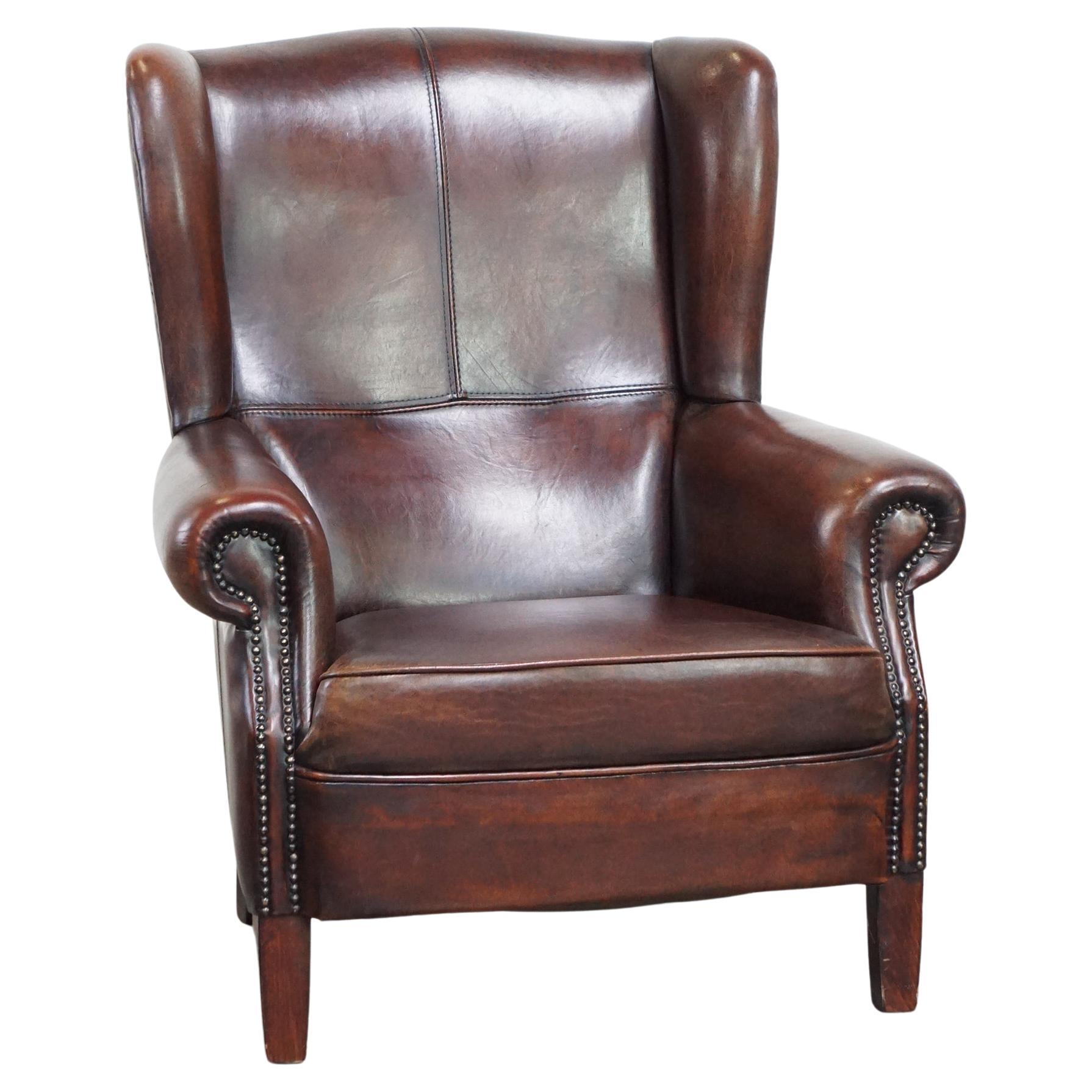 Comfortable and wellmaintained wing chair made of sheep leather For