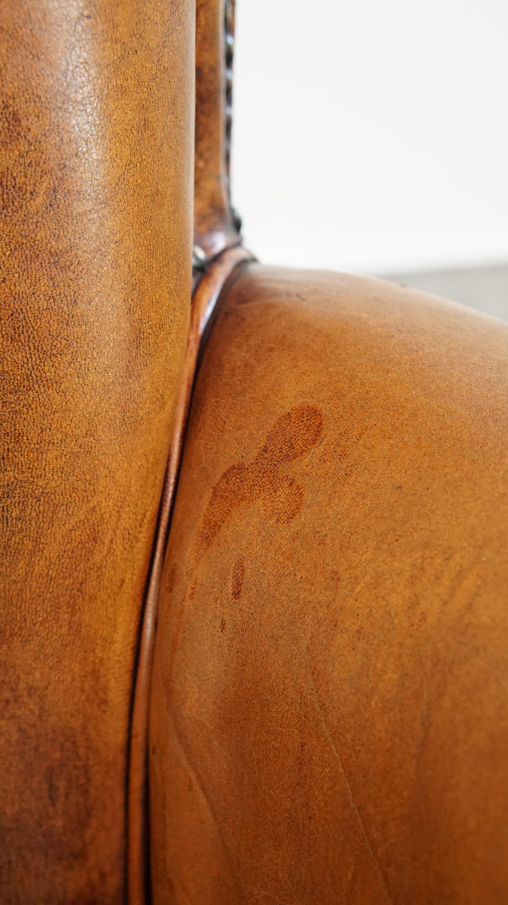 Comfortable armchair made of sheepskin leather finished with decorative nails For Sale 6