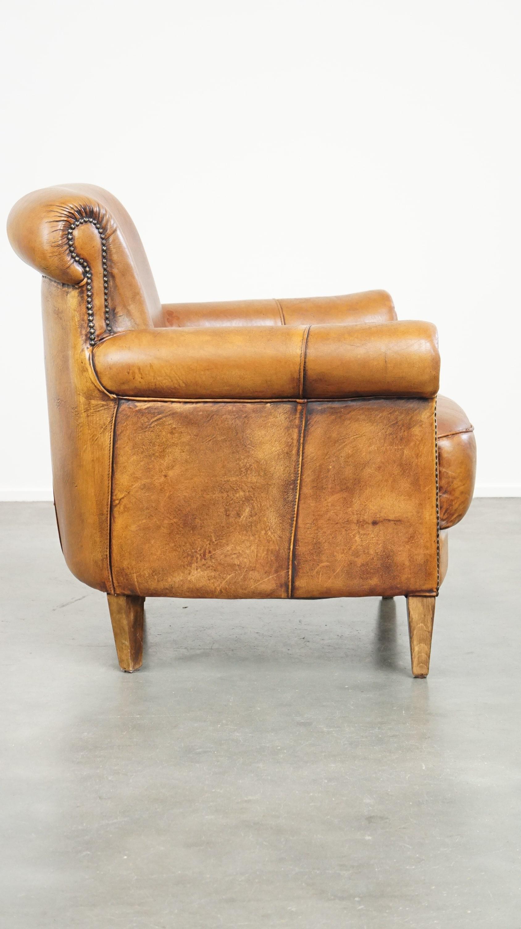 Hand-Crafted Comfortable armchair made of sheepskin leather finished with decorative nails For Sale