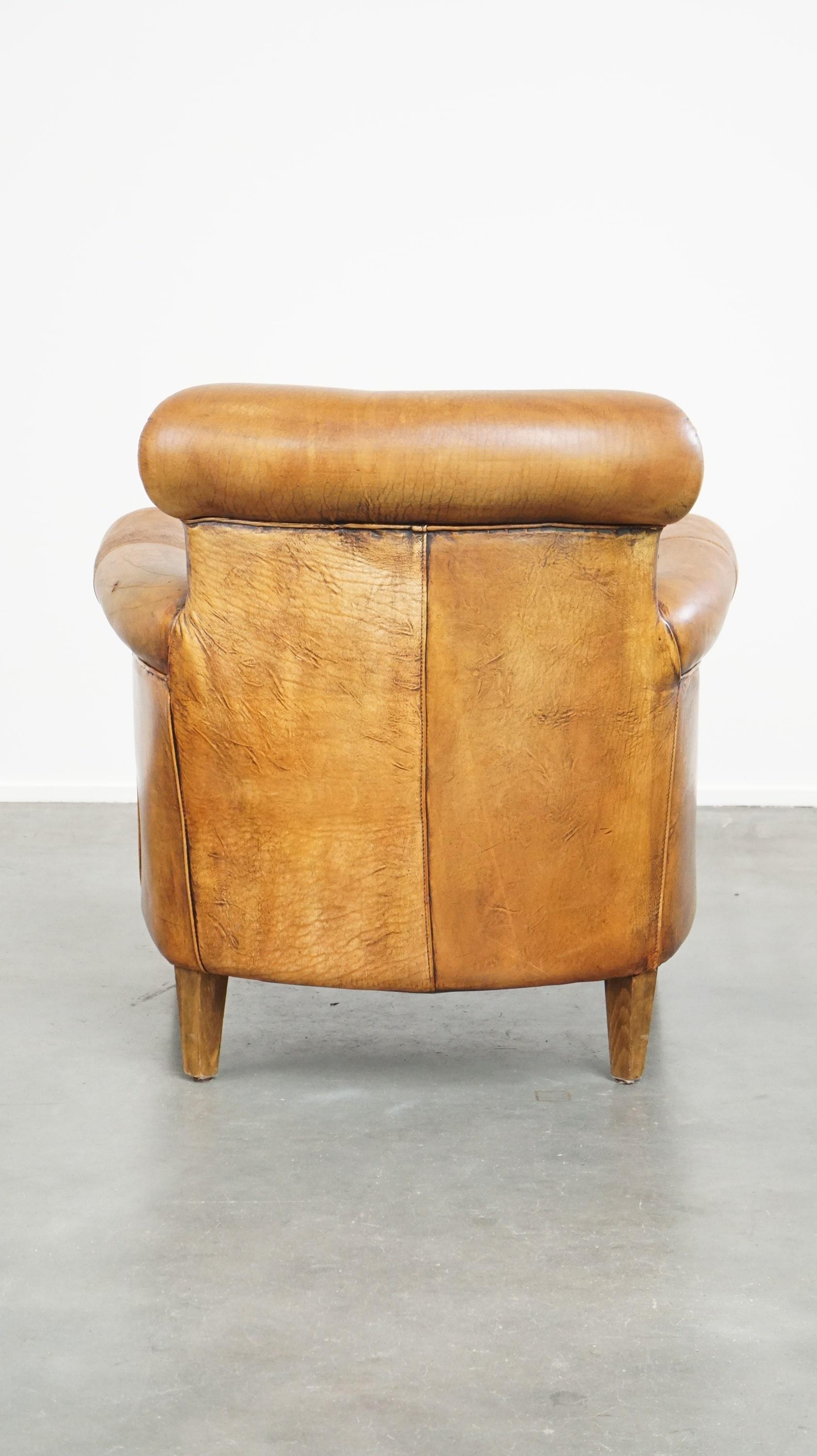 Comfortable armchair made of sheepskin leather finished with decorative nails In Fair Condition For Sale In Harderwijk, NL