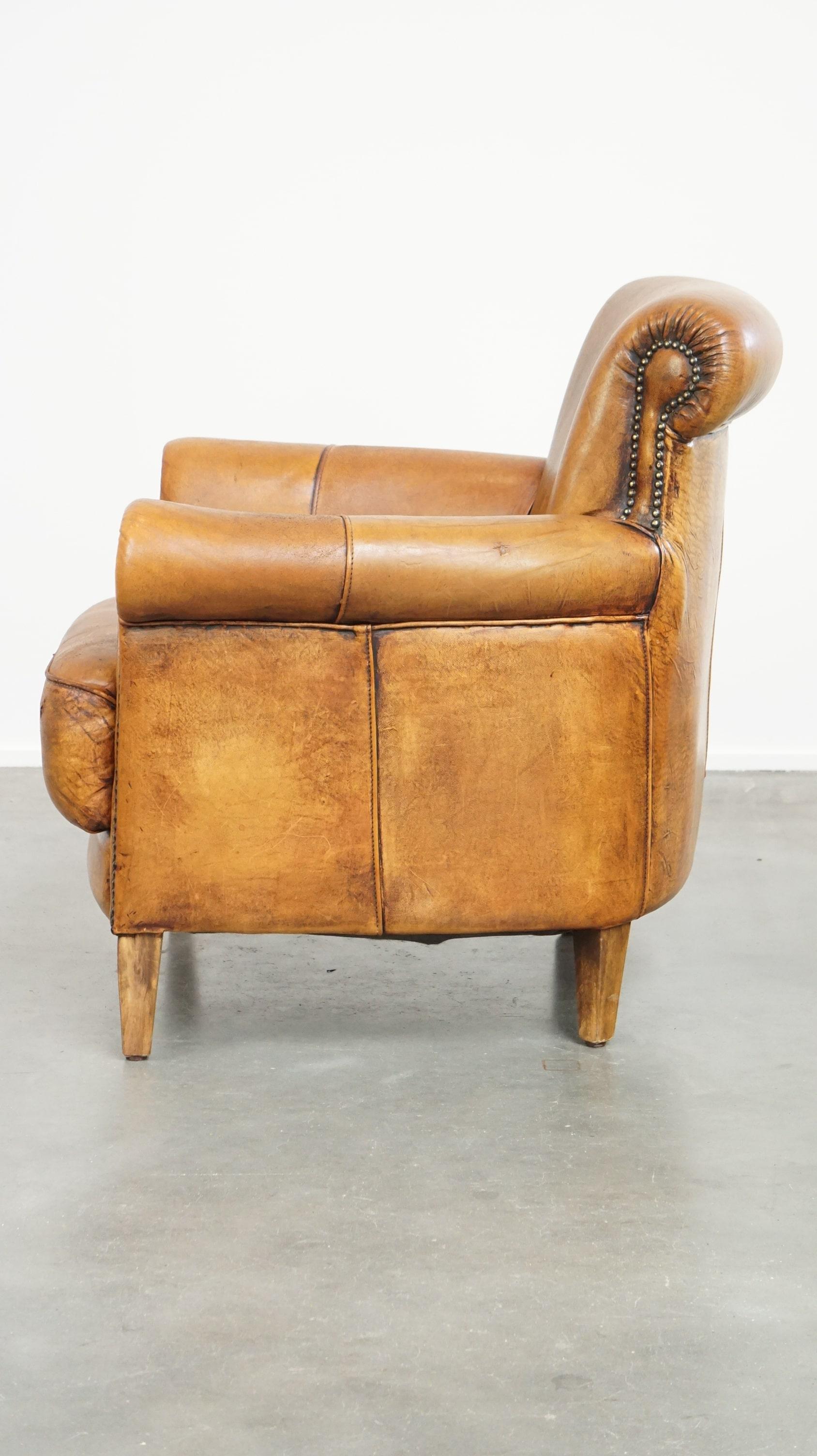 Late 20th Century Comfortable armchair made of sheepskin leather finished with decorative nails For Sale