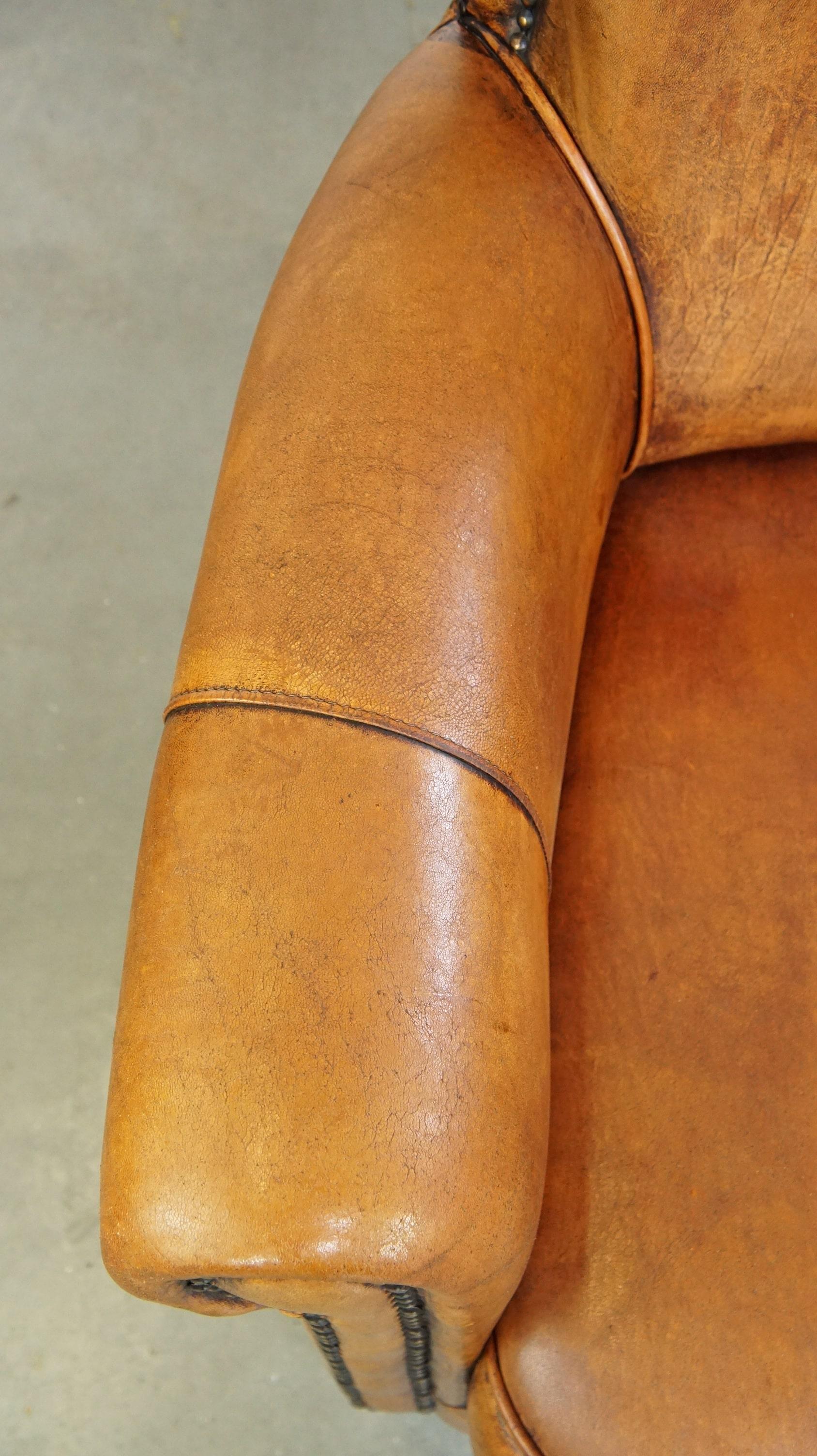 Comfortable armchair made of sheepskin leather finished with decorative nails For Sale 1