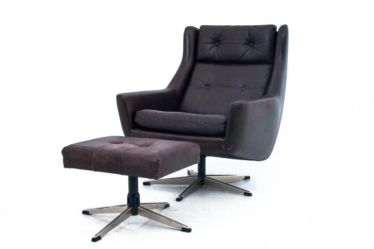 Comfortable Armchair with footstool, Denmark, 1960s.

The set has original leather. Preserved in very good condition, any abrasions visible in the photos.

Dimensions: armchair: height 90 cm seat height 47 cm depth 95 cm width 80 cm footstool: