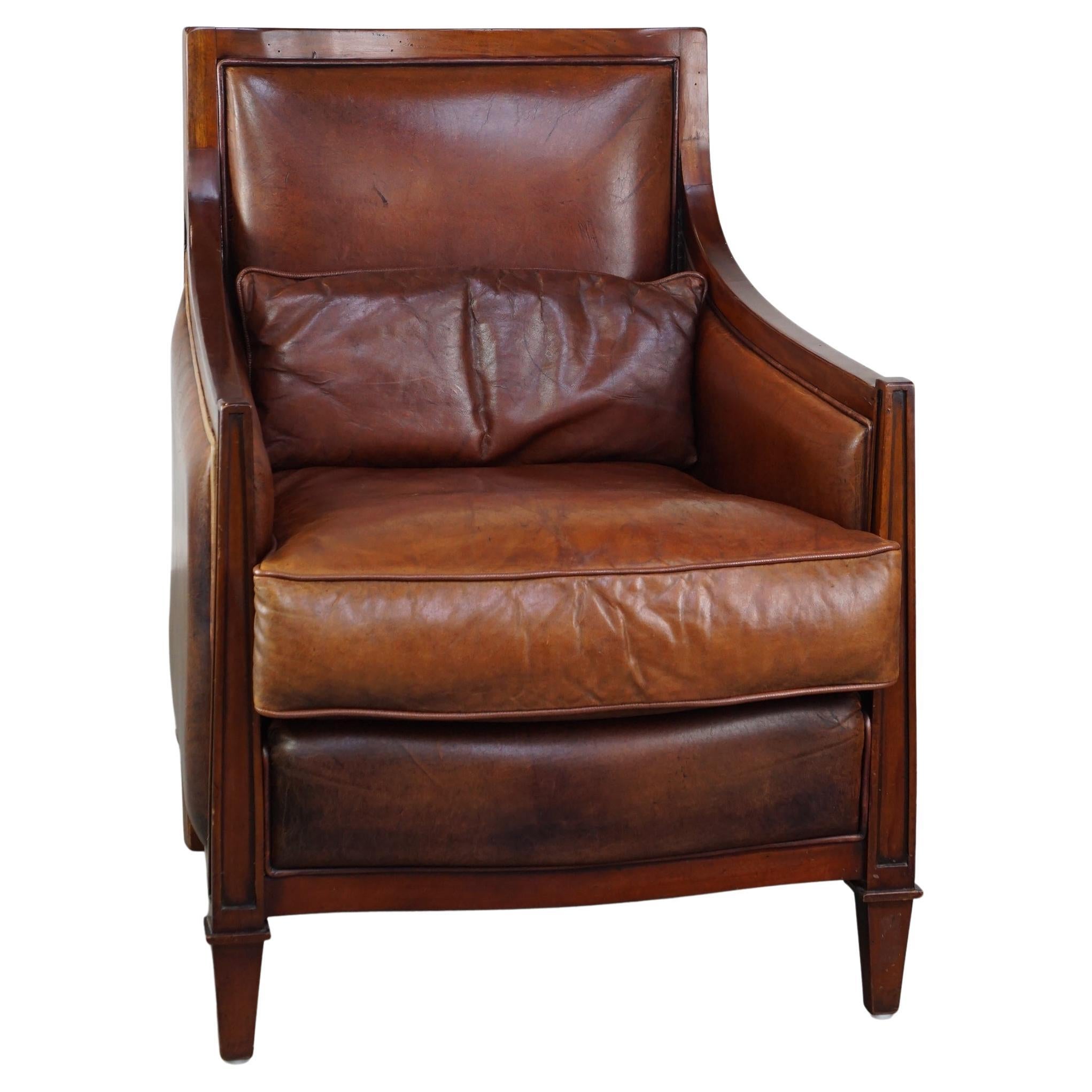 Comfortable Art Deco design armchair in cognac-colored sheepskin