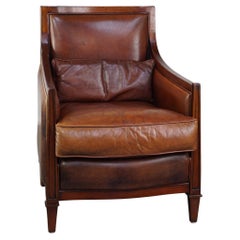Comfortable Art Deco design armchair in cognac-colored sheepskin