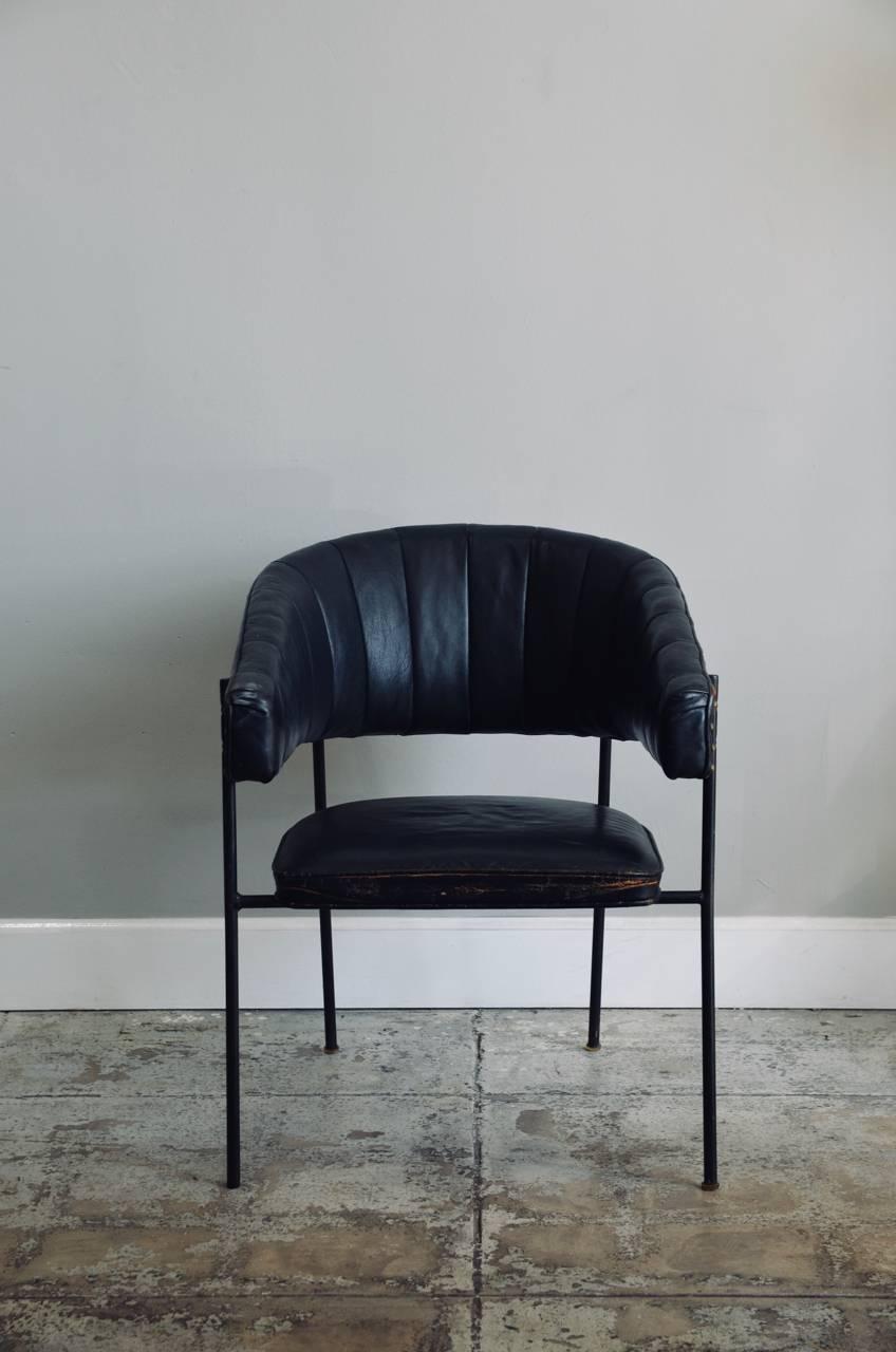 Comfortable black leather croissant armchair in the style of Jacques Adnet. Measure: Seat height is 15.5