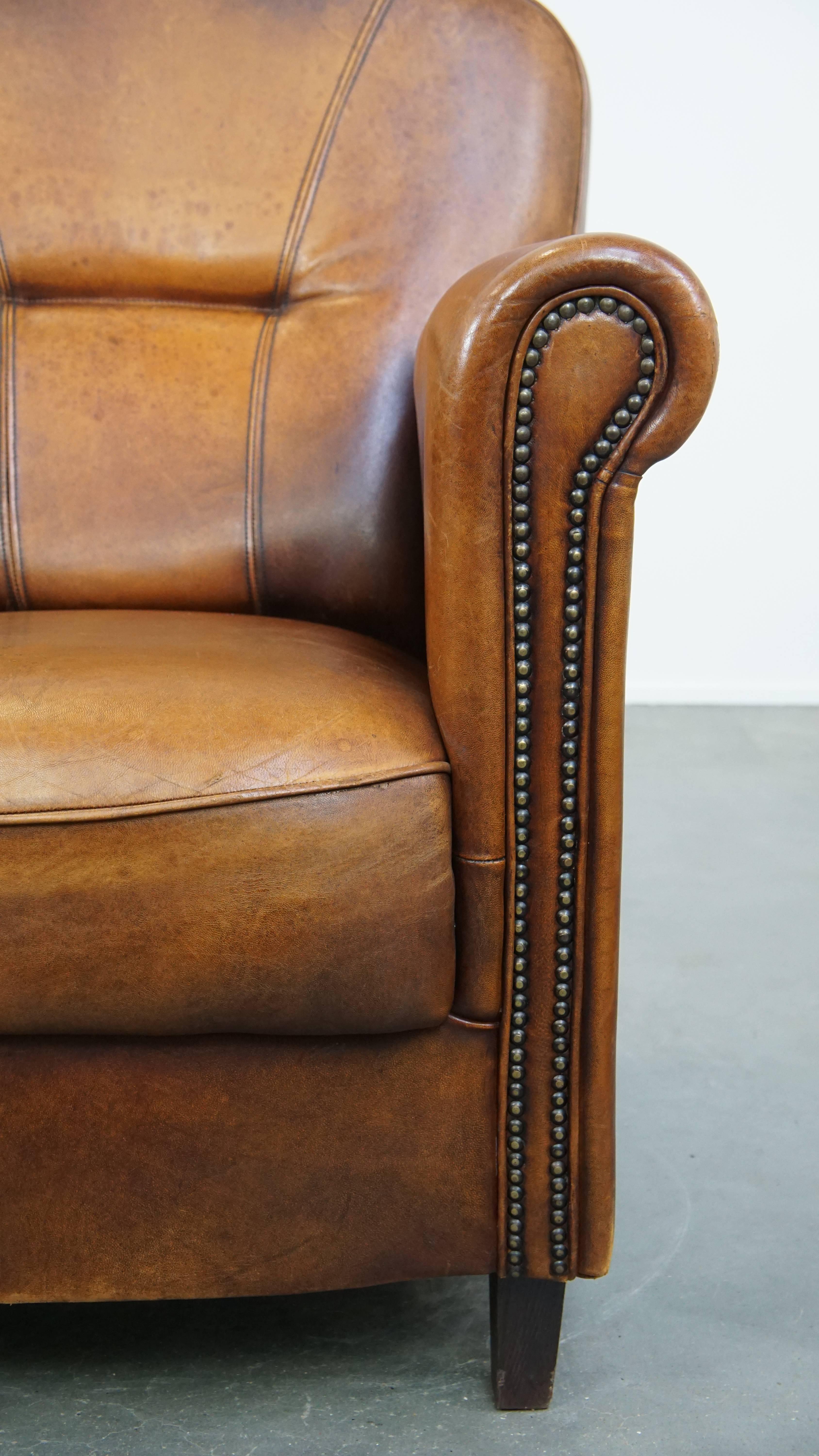 Comfortable Characteristic Sheepskin Leather Armchair with a Stunning Patina For Sale 1