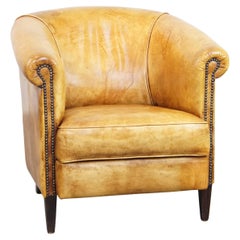 Fauteuil club de style anglais confortable et charmant en cuir clair