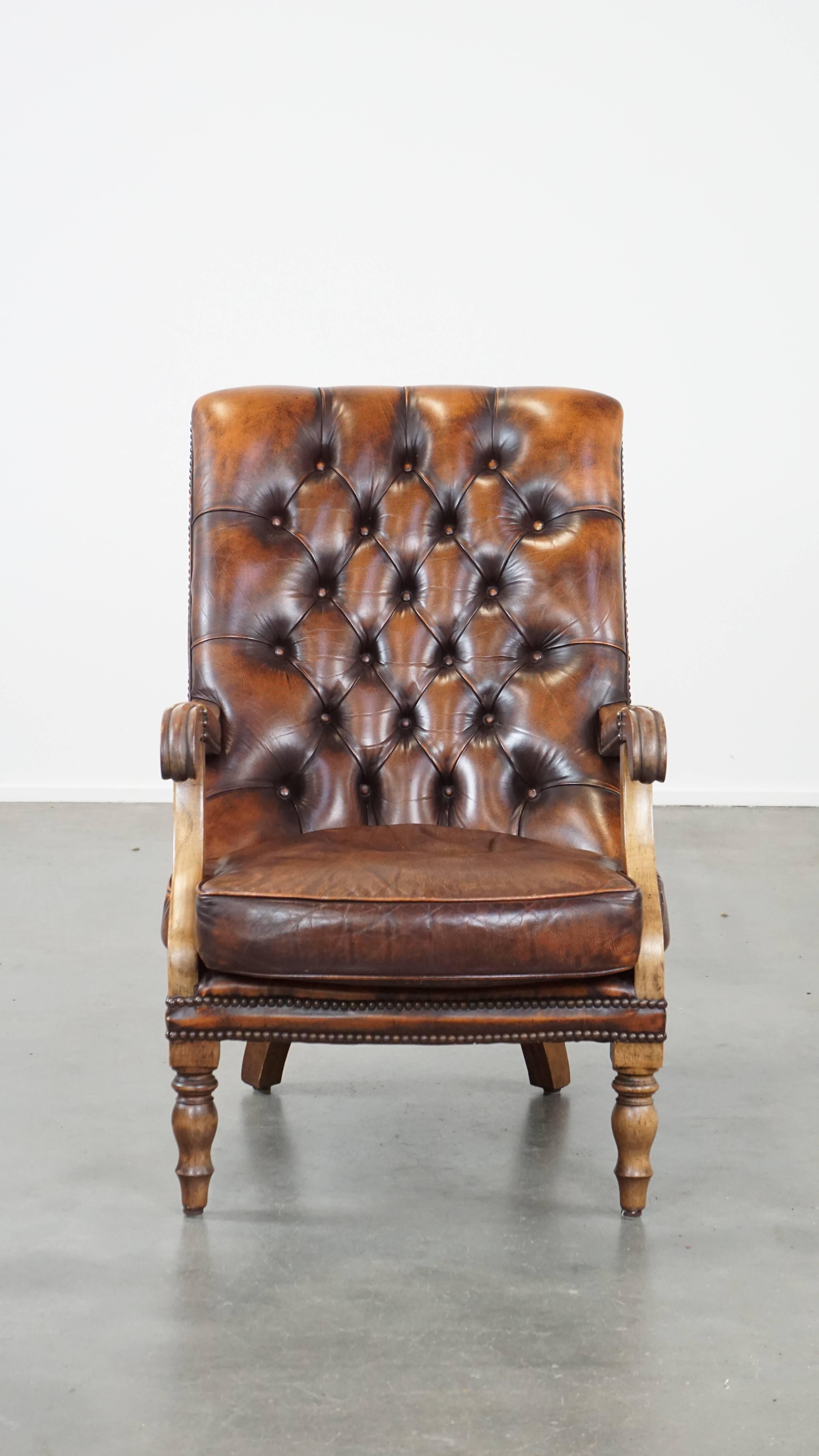 If you're looking for an exceptionally comfortable armchair with classic elegance and luxury, this English leather chesterfield armchair is for you! Its beautiful deep colors and graceful wooden accents give it that classic look. In addition, its