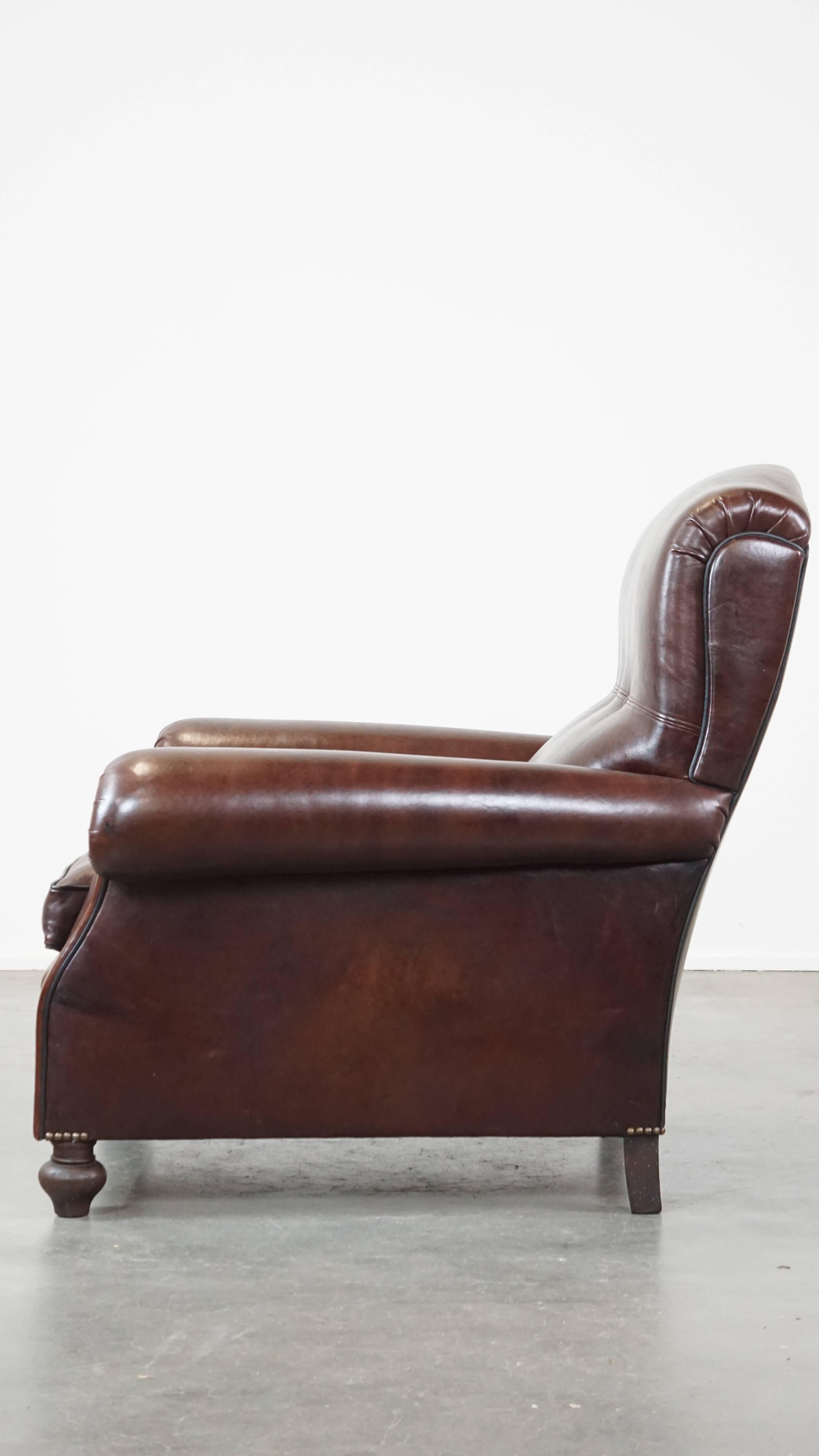 19th Century Comfortable, classic dark antique sheepskin English armchair in good condition For Sale