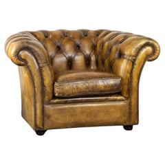 Vintage Comfortable English Chesterfield armchair made of thick cowhide leather
