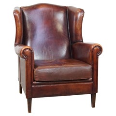 Comfortable English-style sheepskin wingback chair in a lovely deep cognac color