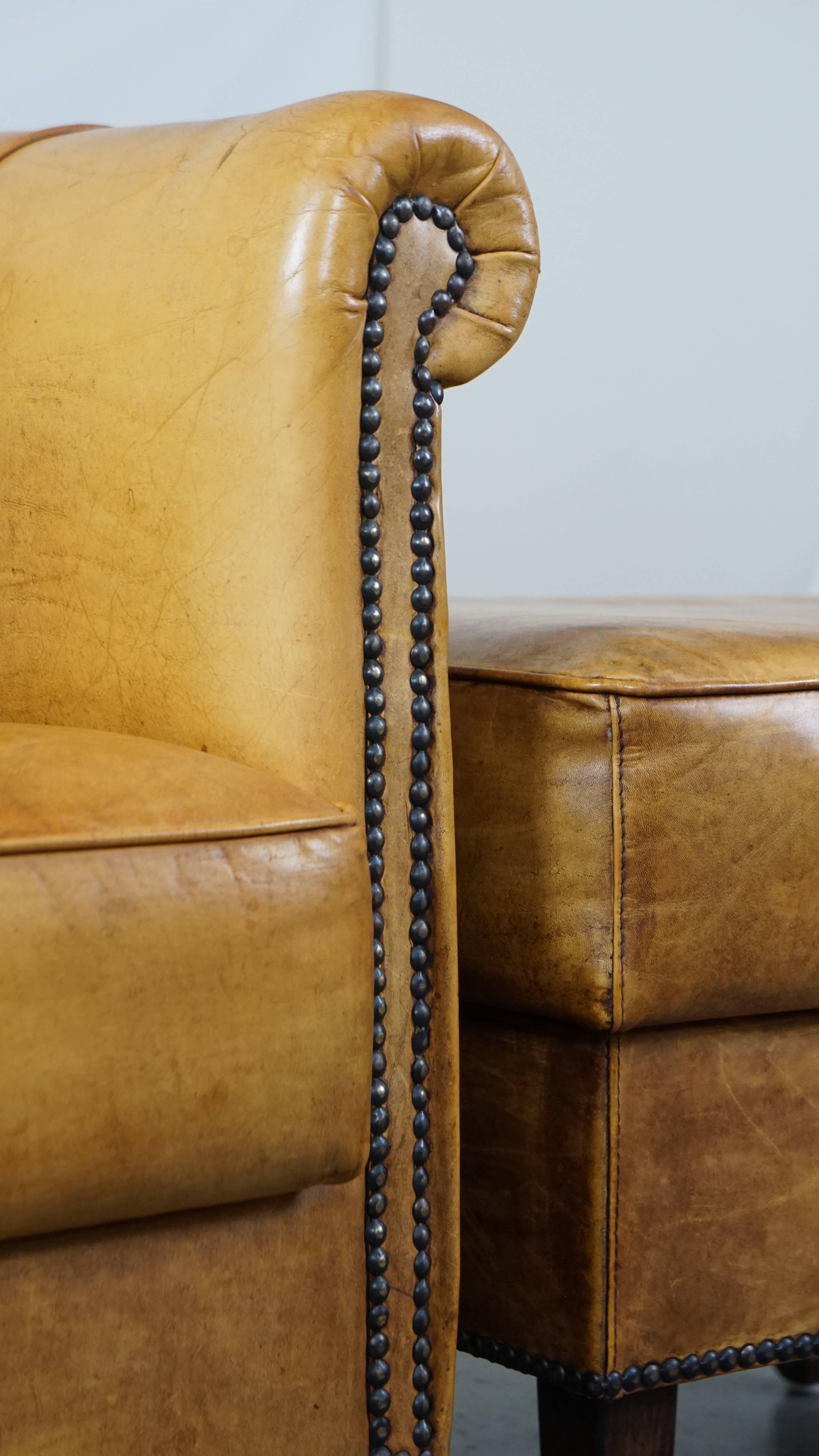 Comfortable leather armchair with ottoman, finished with decorative nails For Sale 7