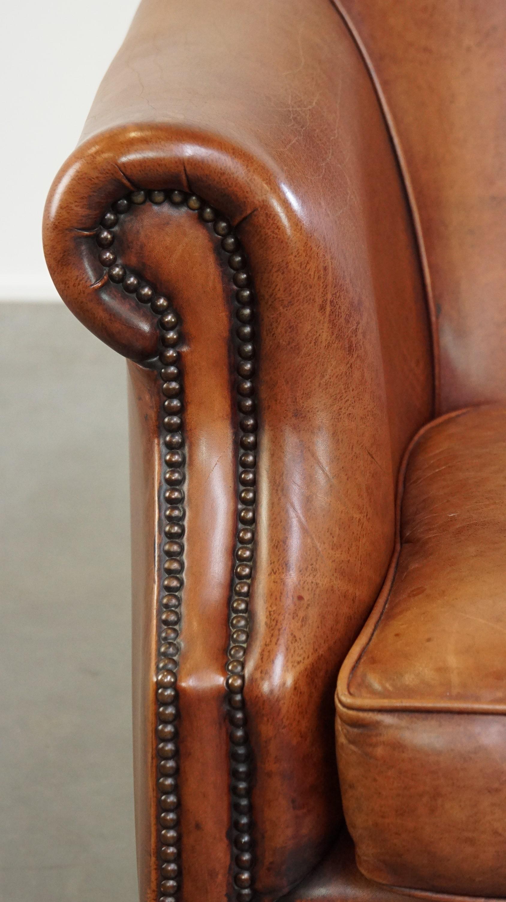 Comfortable leather club armchair with a loose seat cushion 4