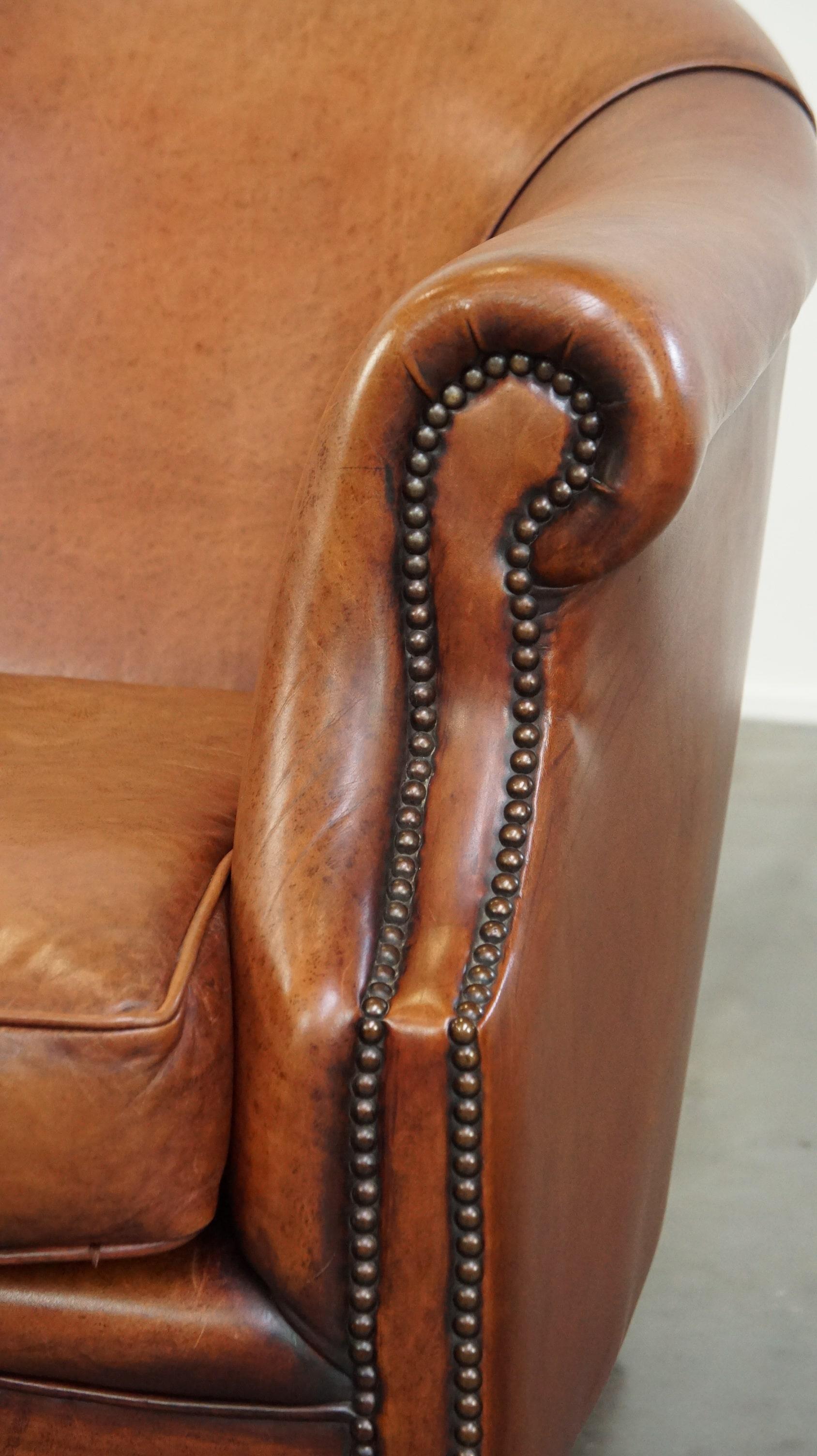 Comfortable leather club armchair with a loose seat cushion 5