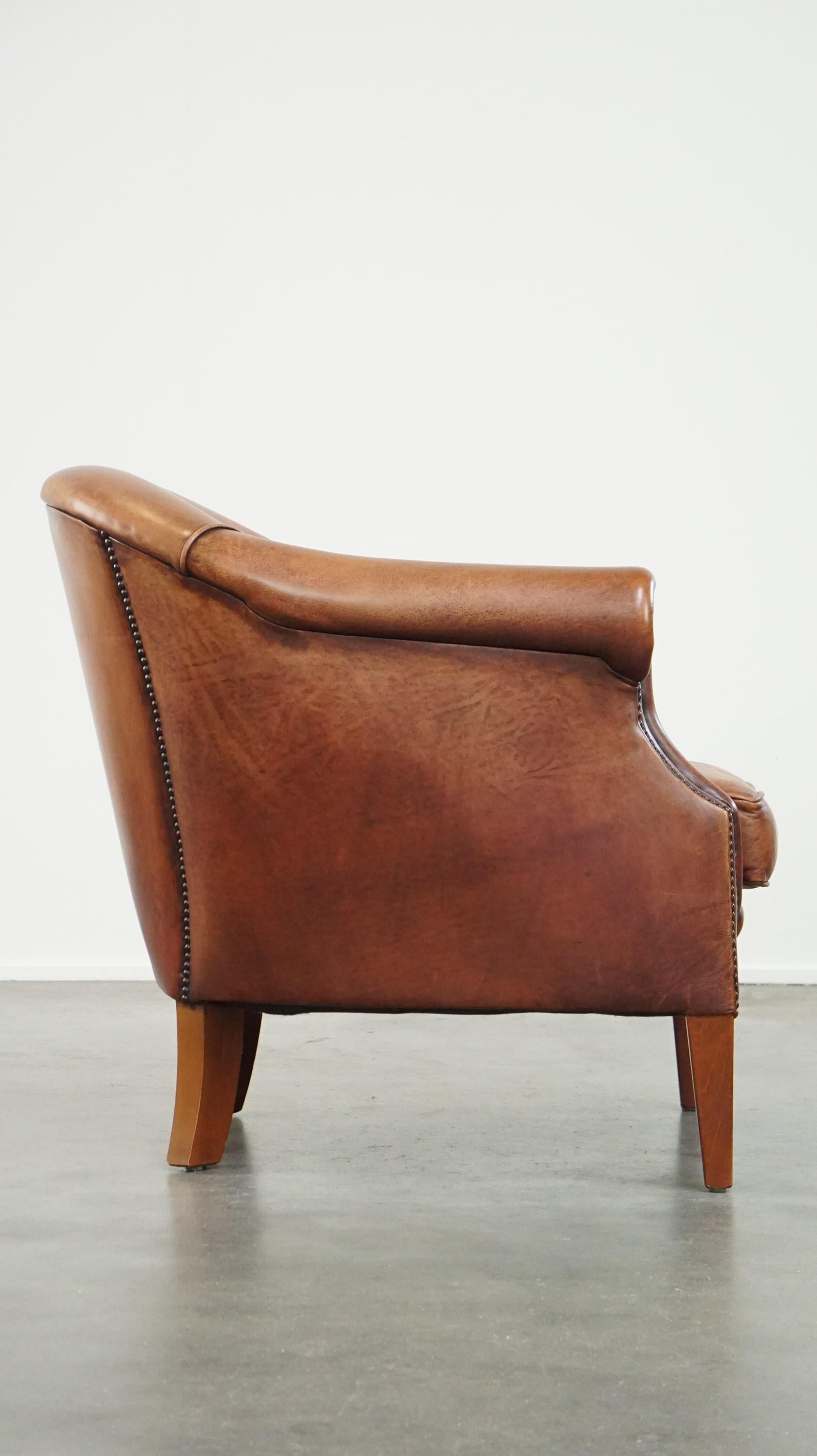 Hand-Crafted Comfortable leather club armchair with a loose seat cushion