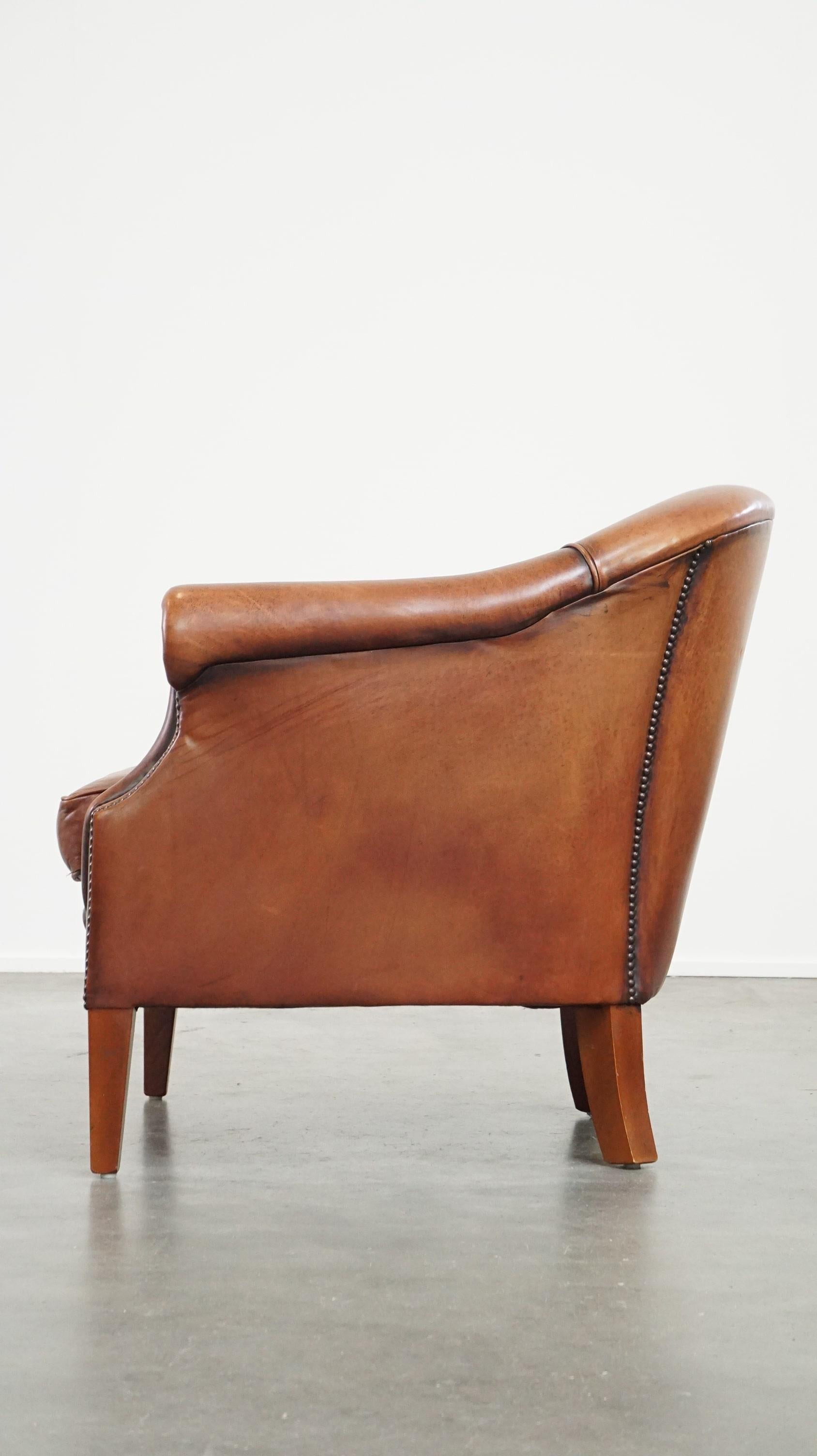 20th Century Comfortable leather club armchair with a loose seat cushion