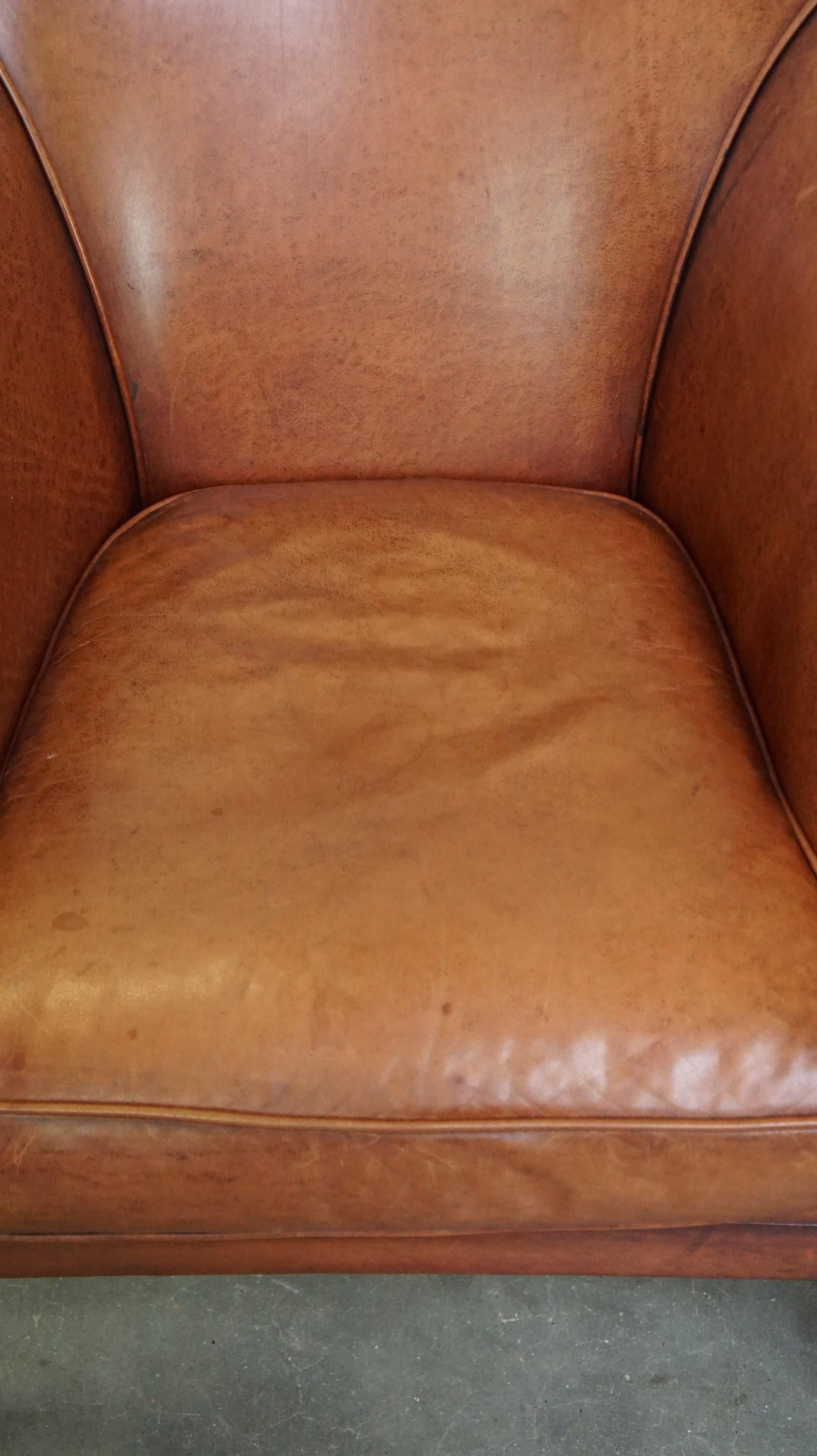 Cowhide Comfortable leather club armchair with a loose seat cushion