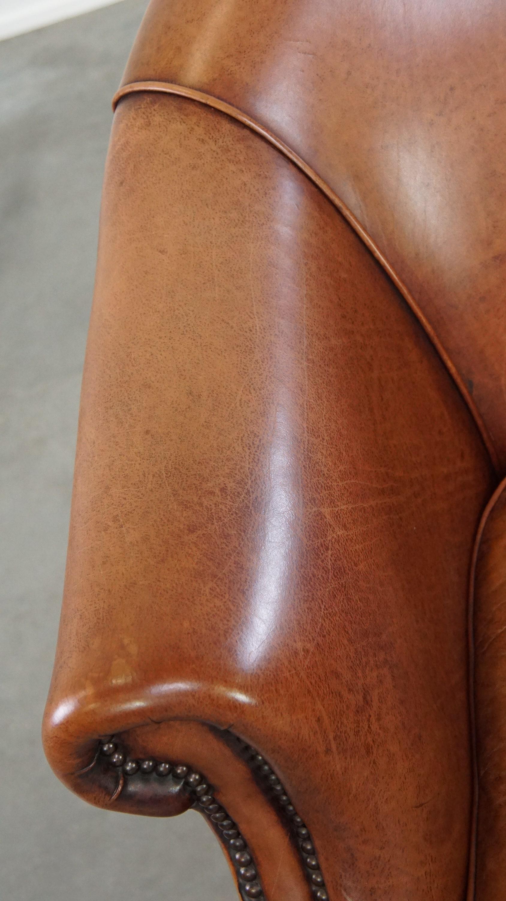 Comfortable leather club armchair with a loose seat cushion 1