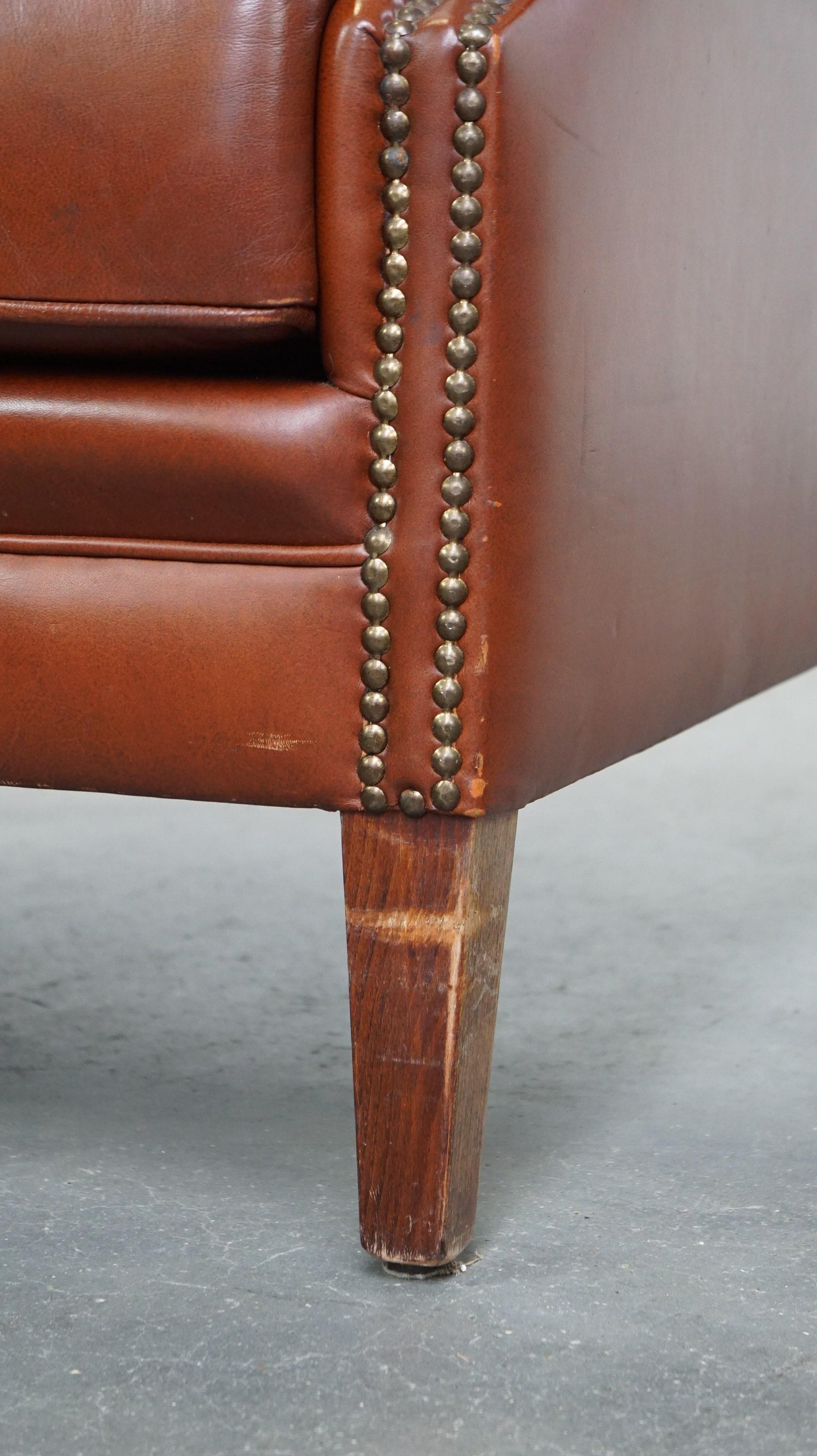 Comfortable, luxury English-style cognac-colored leather wingback armchair For Sale 4