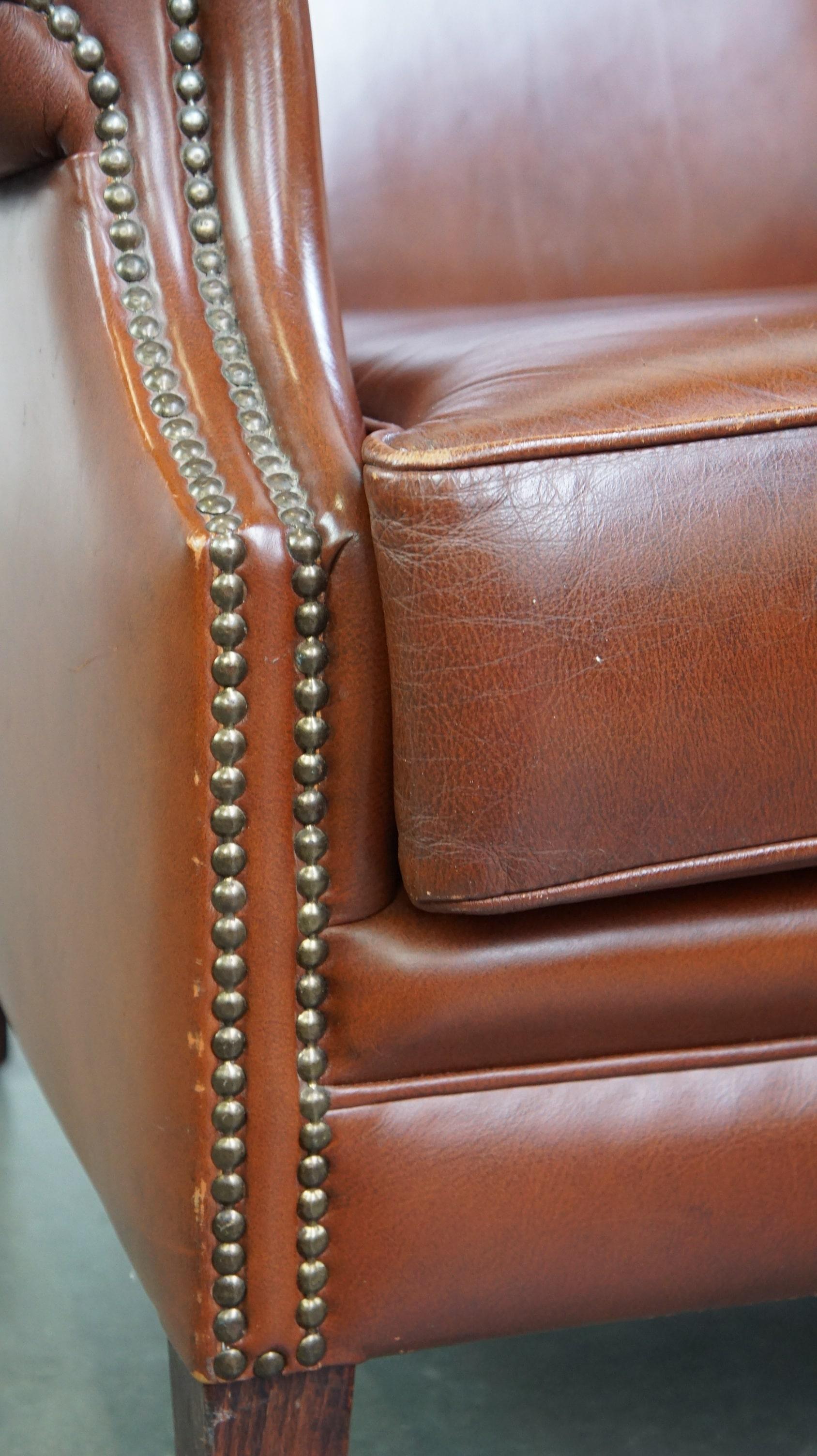 Comfortable, luxury English-style cognac-colored leather wingback armchair For Sale 5