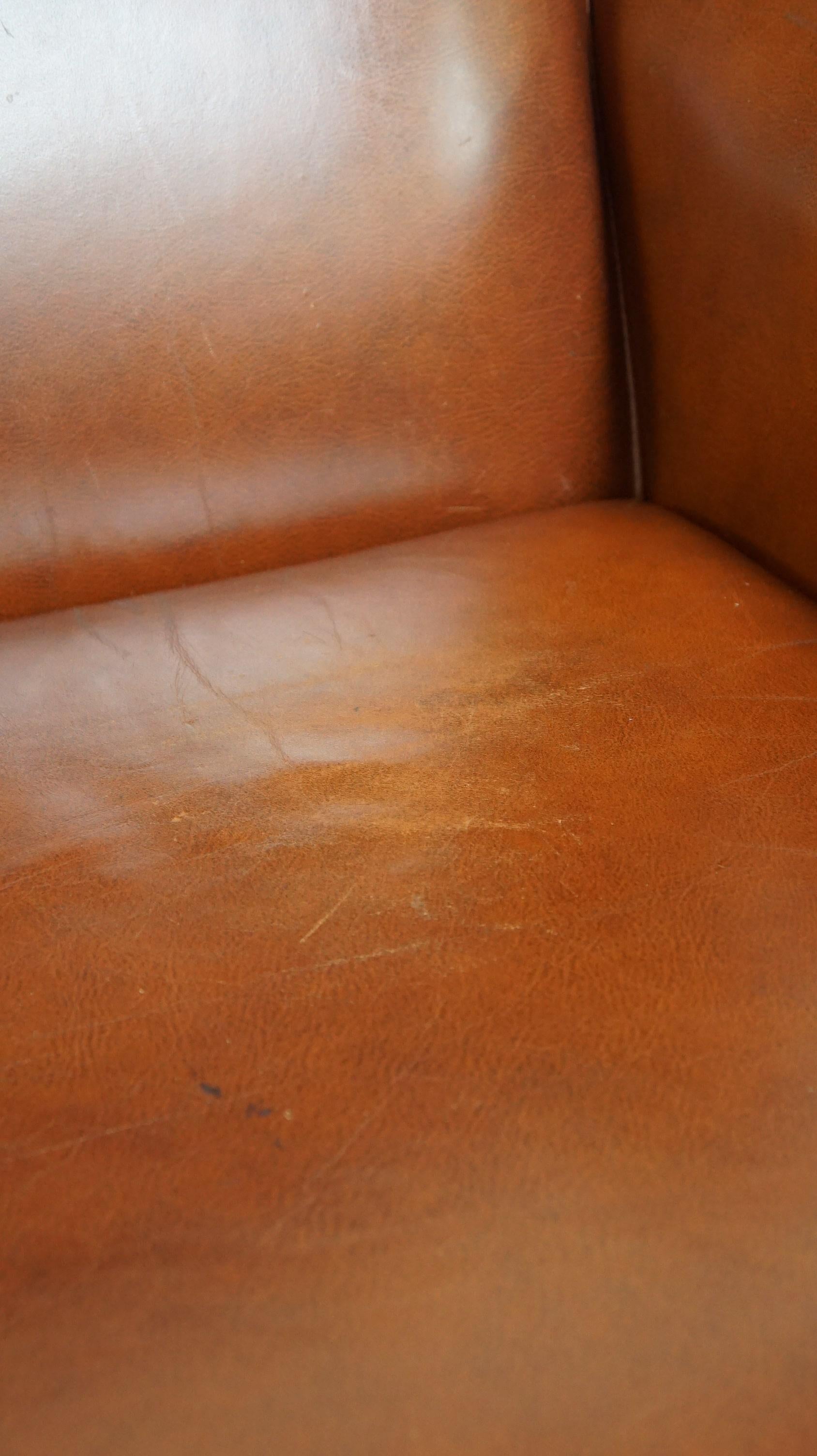 Comfortable, luxury English-style cognac-colored leather wingback armchair For Sale 6
