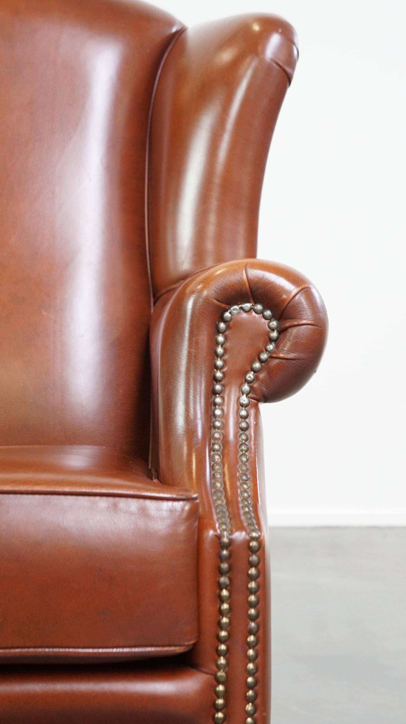 Comfortable, luxury English-style cognac-colored leather wingback armchair For Sale 7
