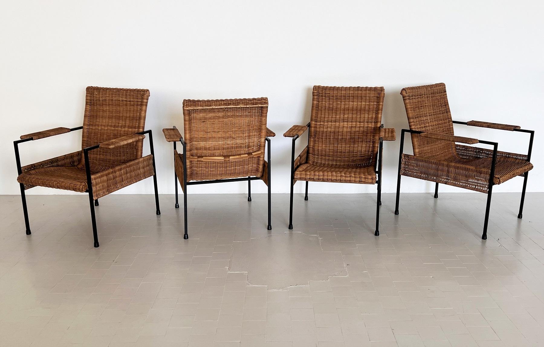 Cozy and very comfortable lounge chairs with generous big seat.
Made in the 1960s in Italy.
The complete curvy seat and backrest is made of handmade wicker-rattan and in overall very good condition with very small signs of use.
The armrests are also