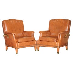 Used COMFORTABLE PAiR OF FRENCH NEOCLASSICAL STYLE LEATHER & BRASS RECLINER ARMCHAIRS