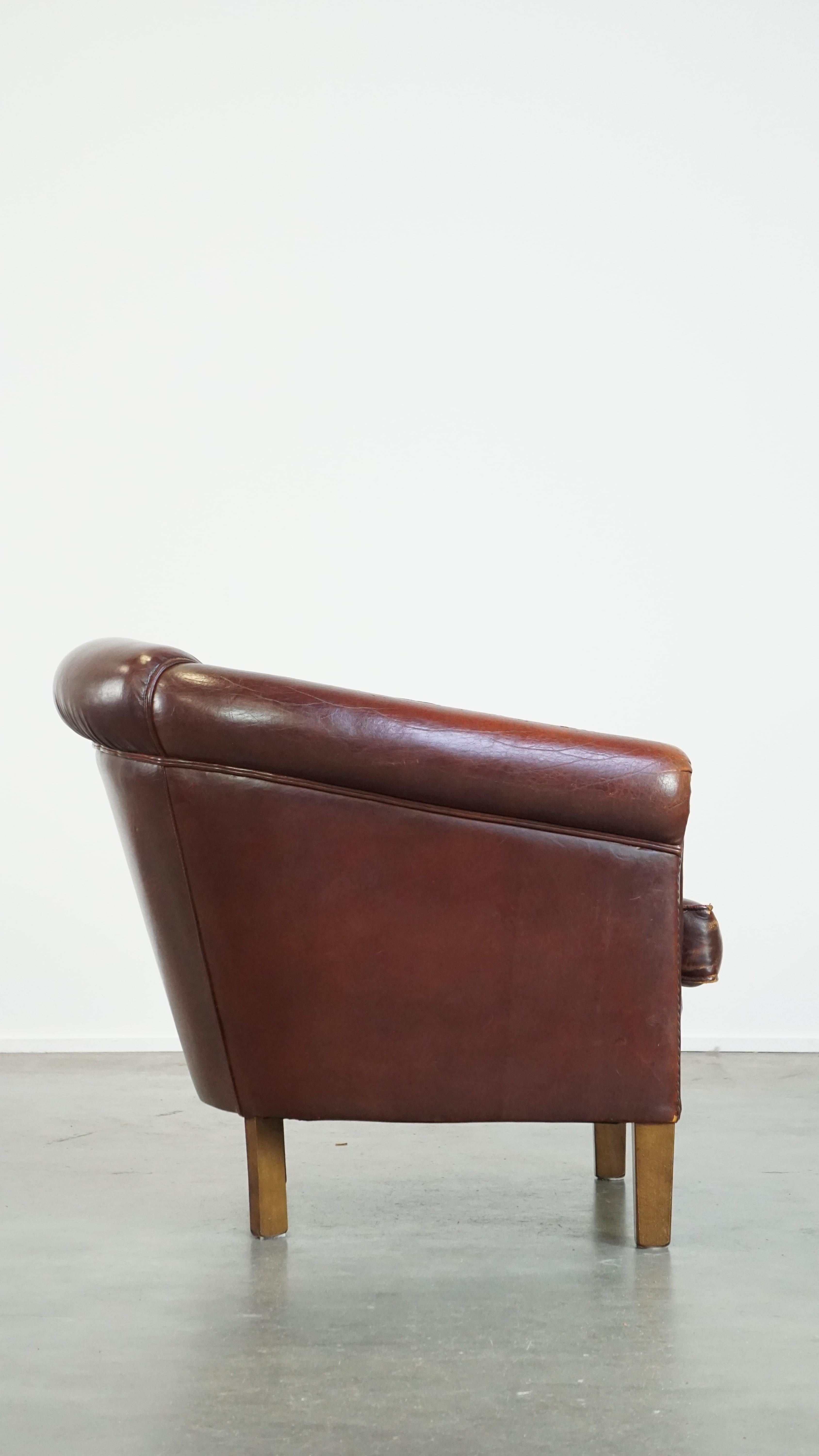 Hand-Crafted Comfortable, rugged cognac-colored sheepskin club armchair For Sale