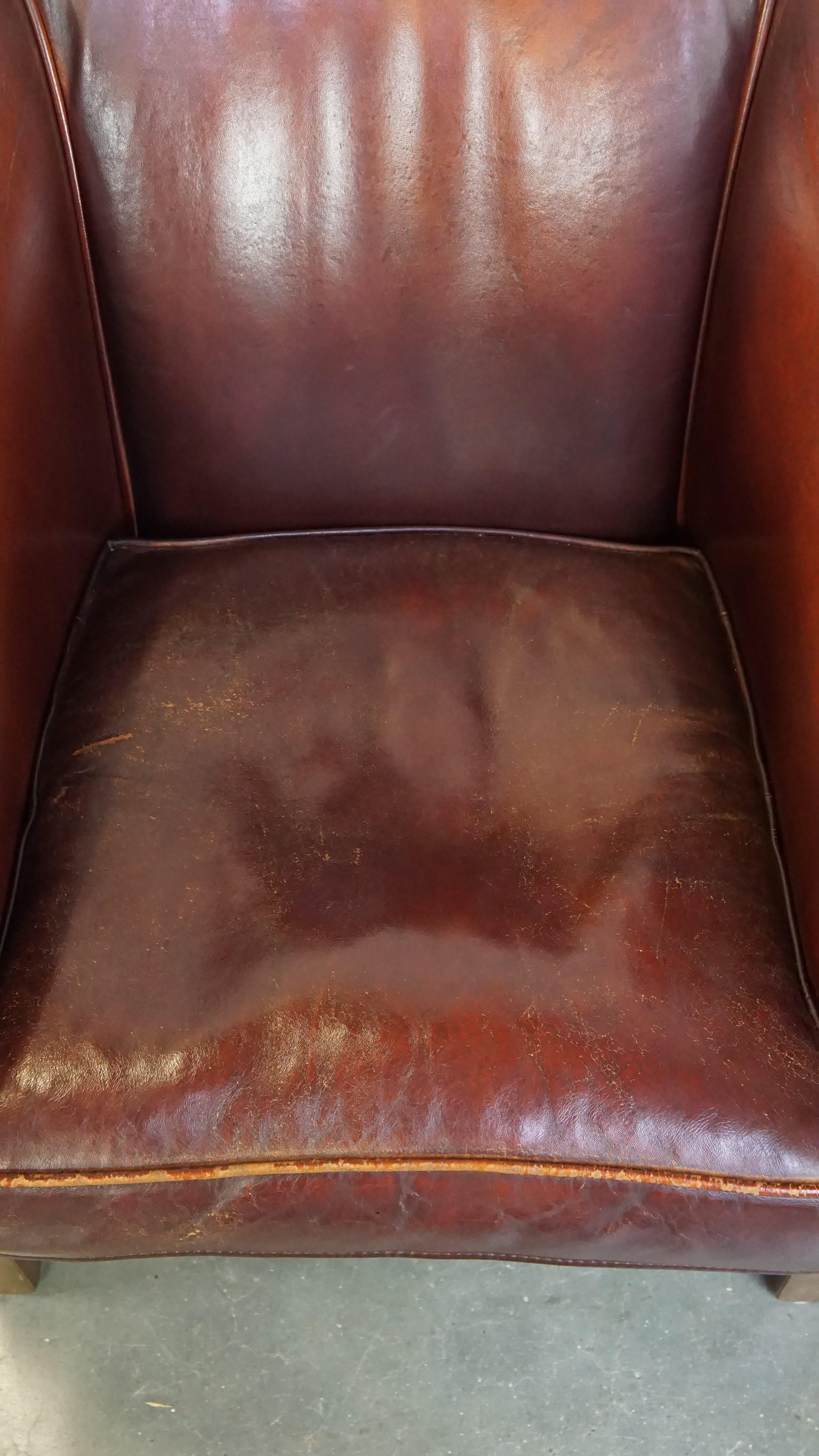 Sheepskin Comfortable, rugged cognac-colored sheepskin club armchair For Sale
