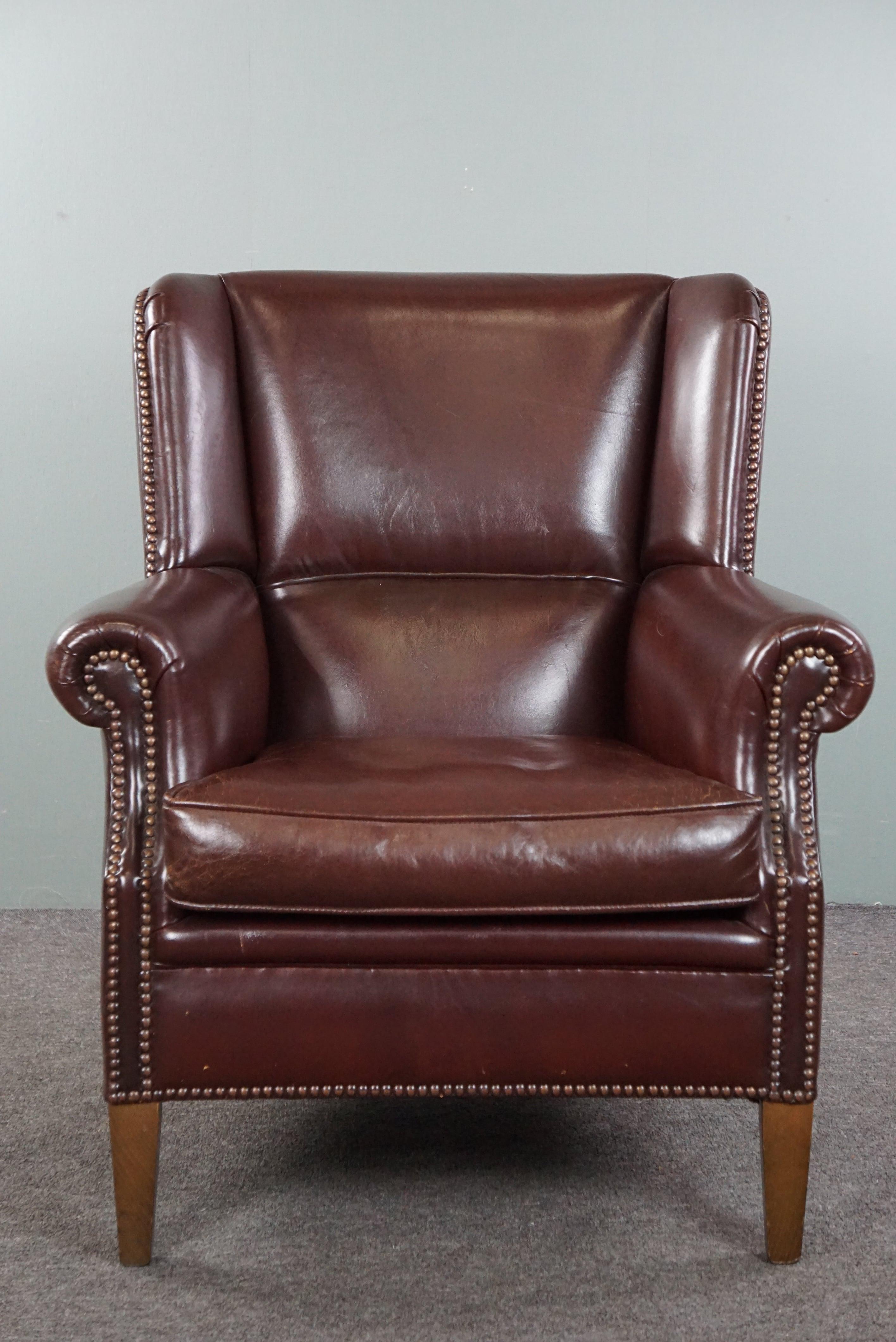 Offered is this comfortable sheep leather armchair finished in a lovely warm color adorned with nails. Attention to those who love a comfortable sheep leather armchair, this might be the one.

This proper armchair provides good comfort and a solid