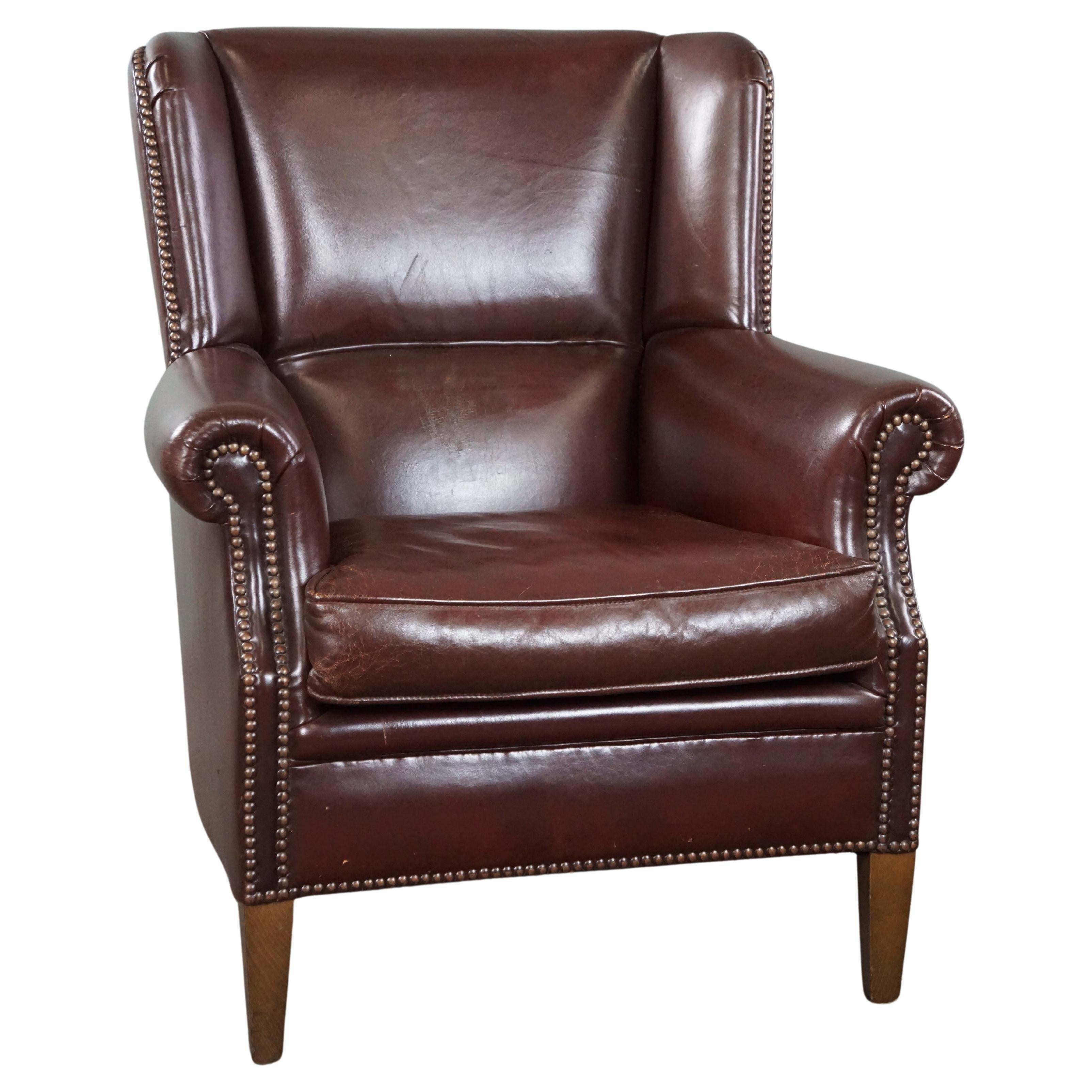 Comfortable sheep leather armchair in a beautiful warm color For Sale