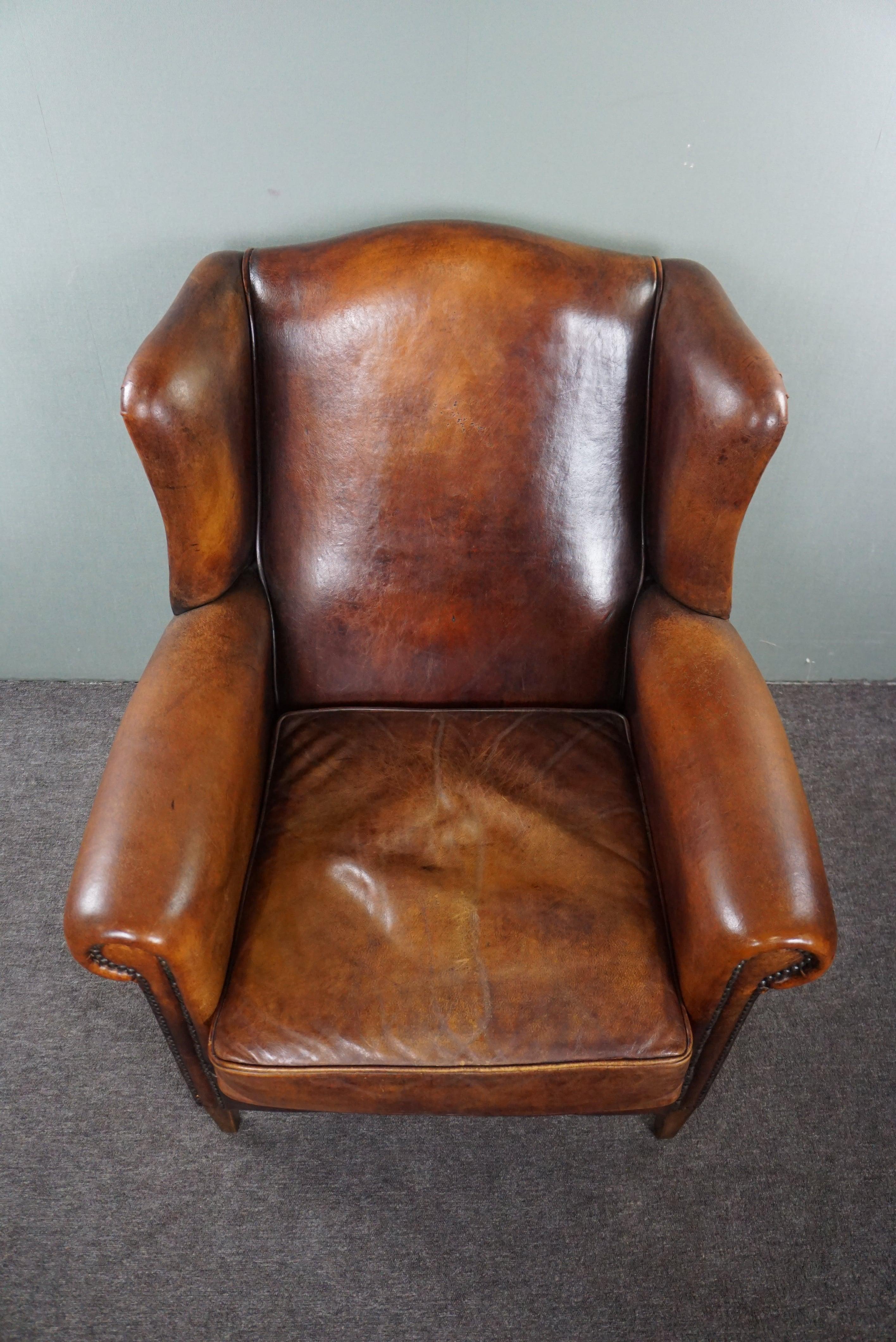 Comfortable sheep leather wingback chair with unbelievably warm colors In Good Condition For Sale In Harderwijk, NL