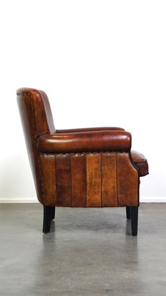 Comfortable sheepskin armchair with a beautiful finish and deep color