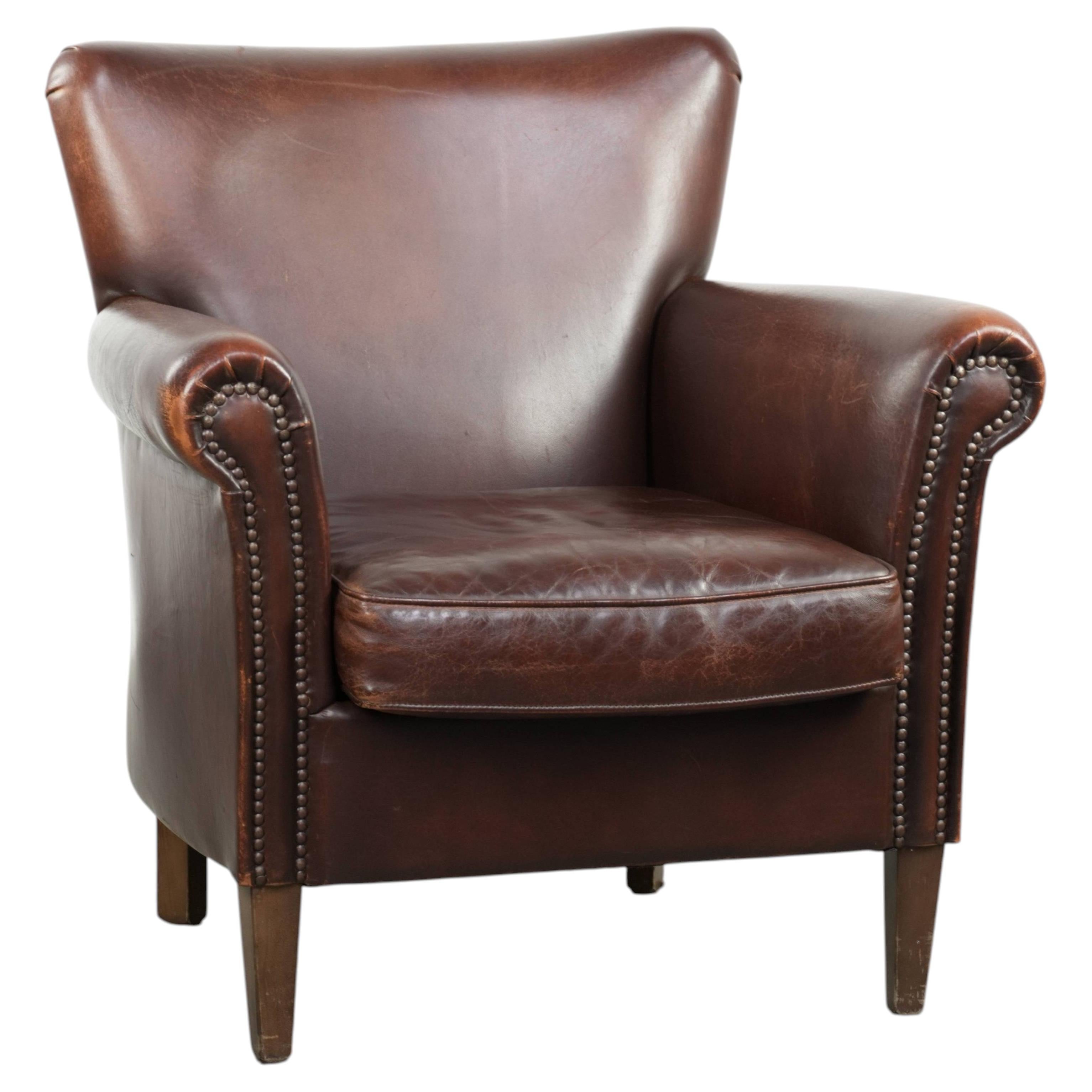 Comfortable sheepskin armchair with character and a good dose of elegance