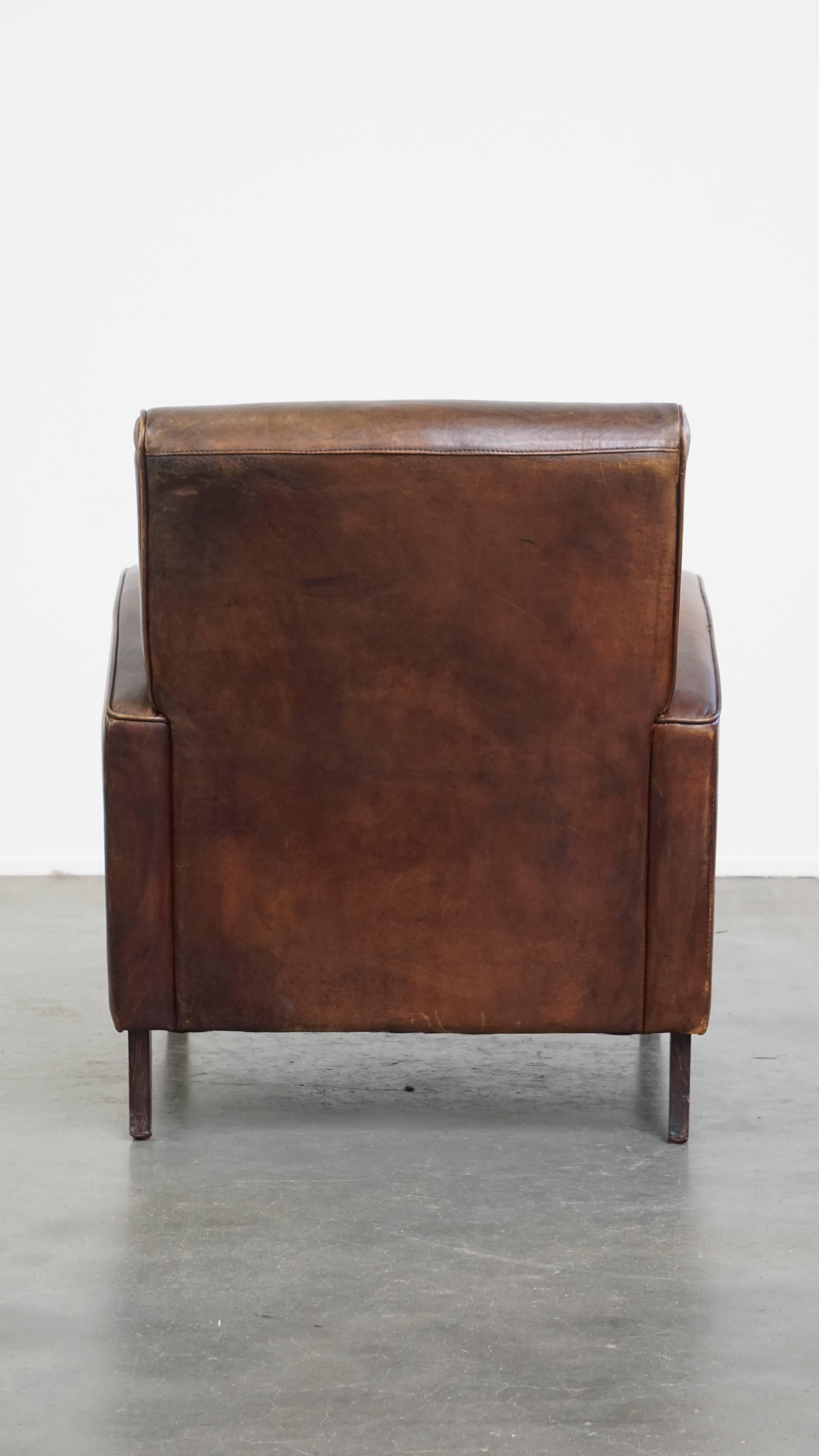 Hand-Crafted Comfortable Sheepskin Leather Armchair with a Beautiful Patina For Sale