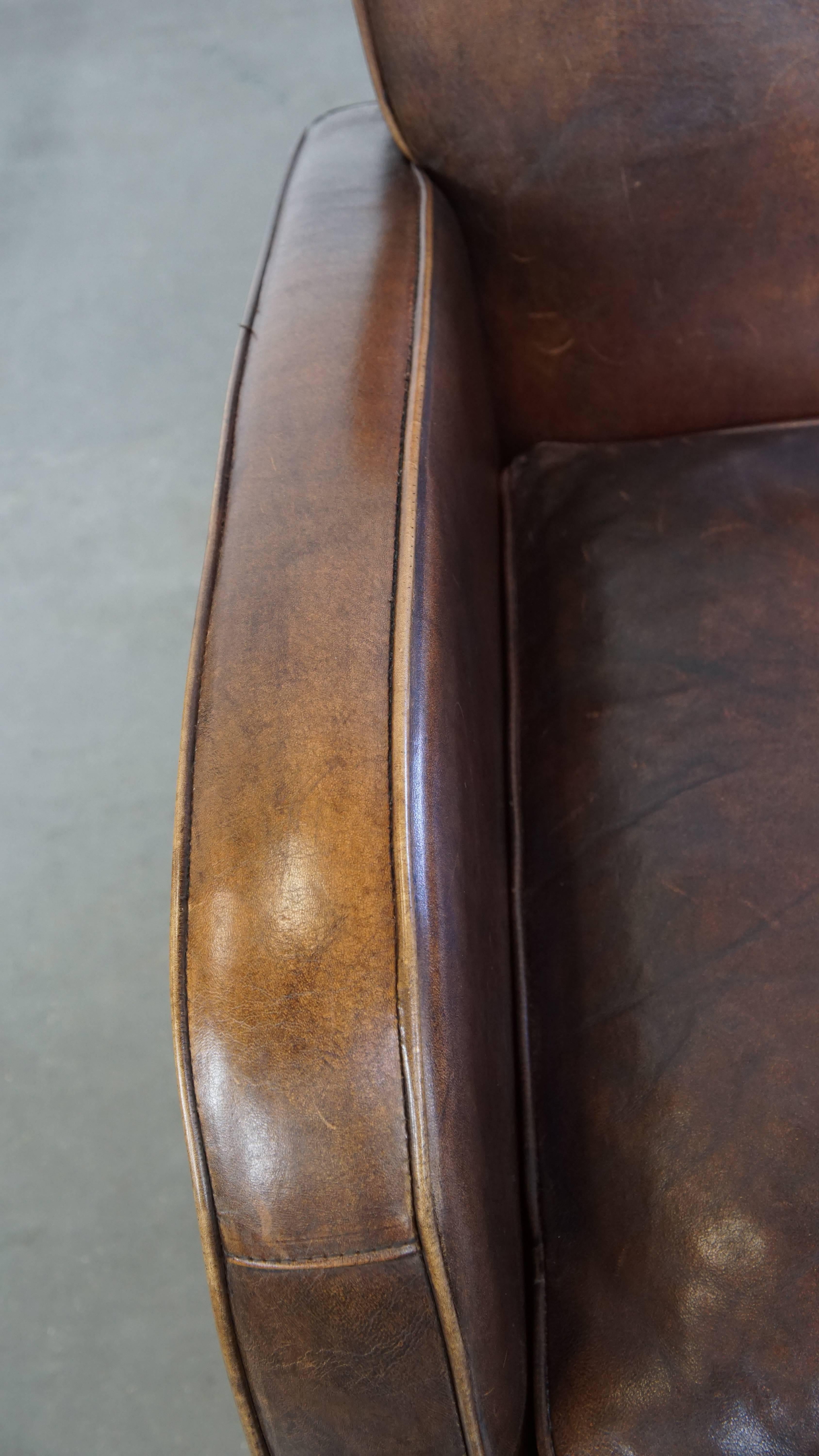 Comfortable Sheepskin Leather Armchair with a Beautiful Patina For Sale 1