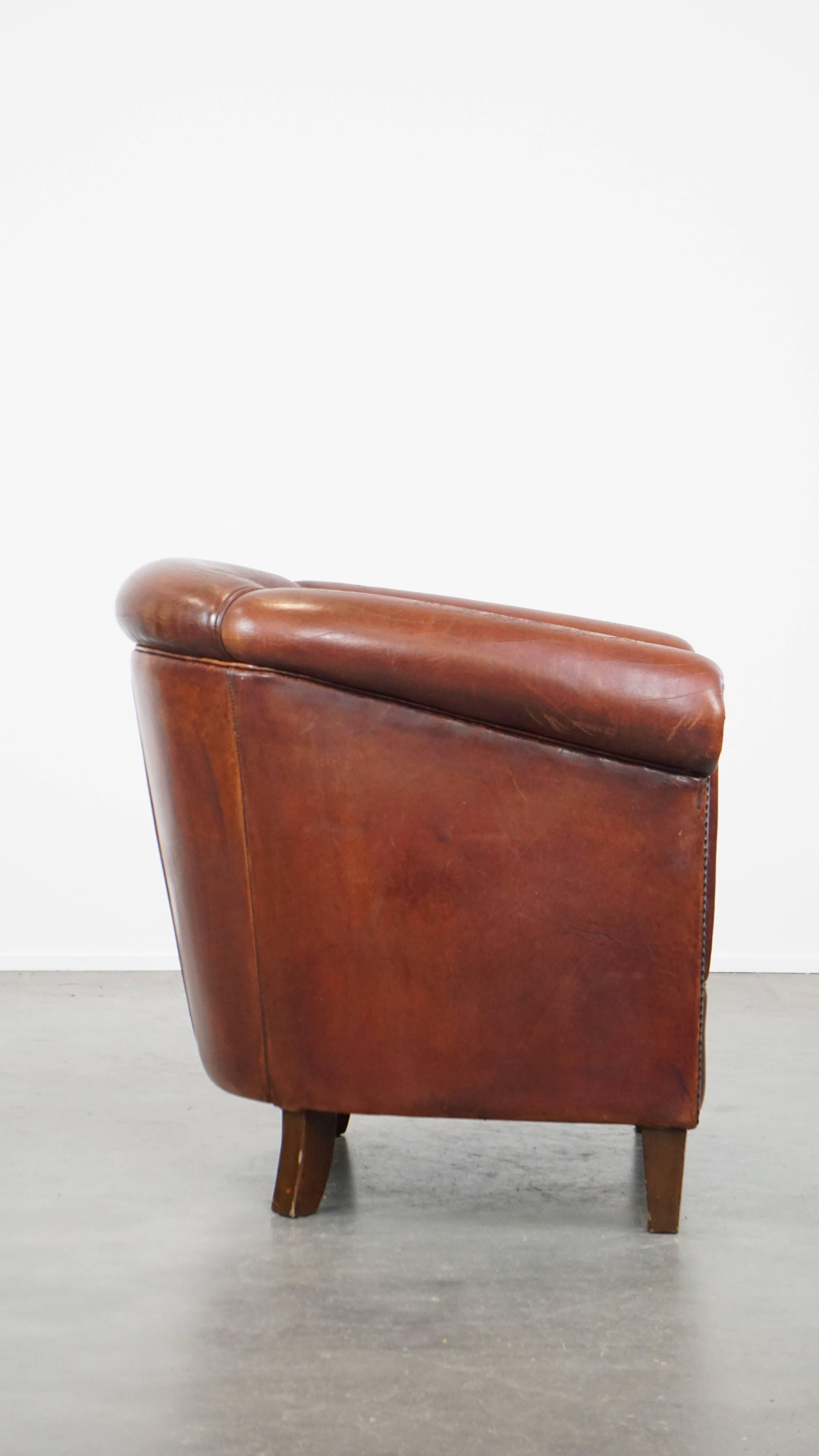 Dutch Comfortable vintage English style sheepskin club chair with a beautiful patina For Sale