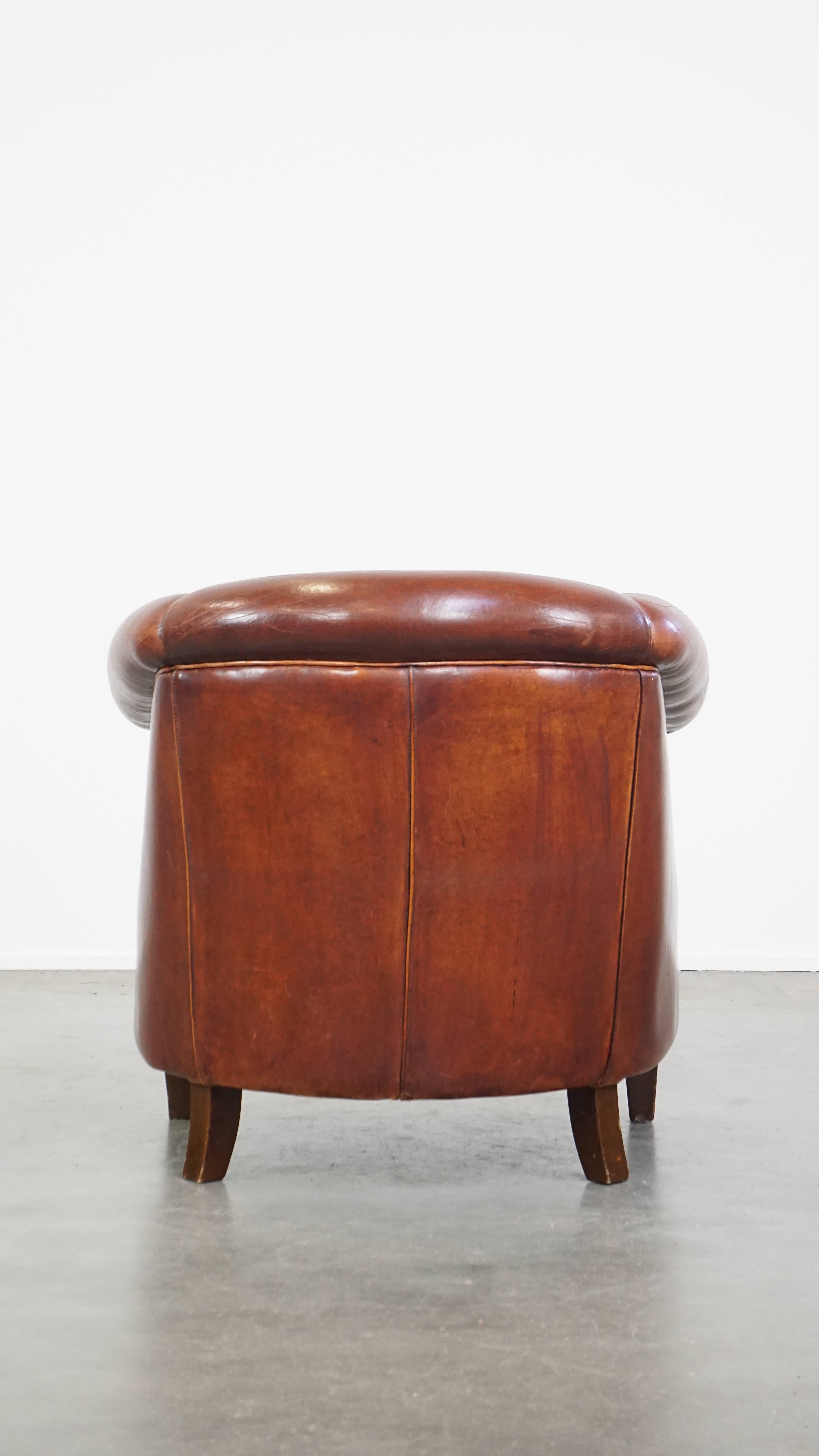 Hand-Crafted Comfortable vintage English style sheepskin club chair with a beautiful patina For Sale