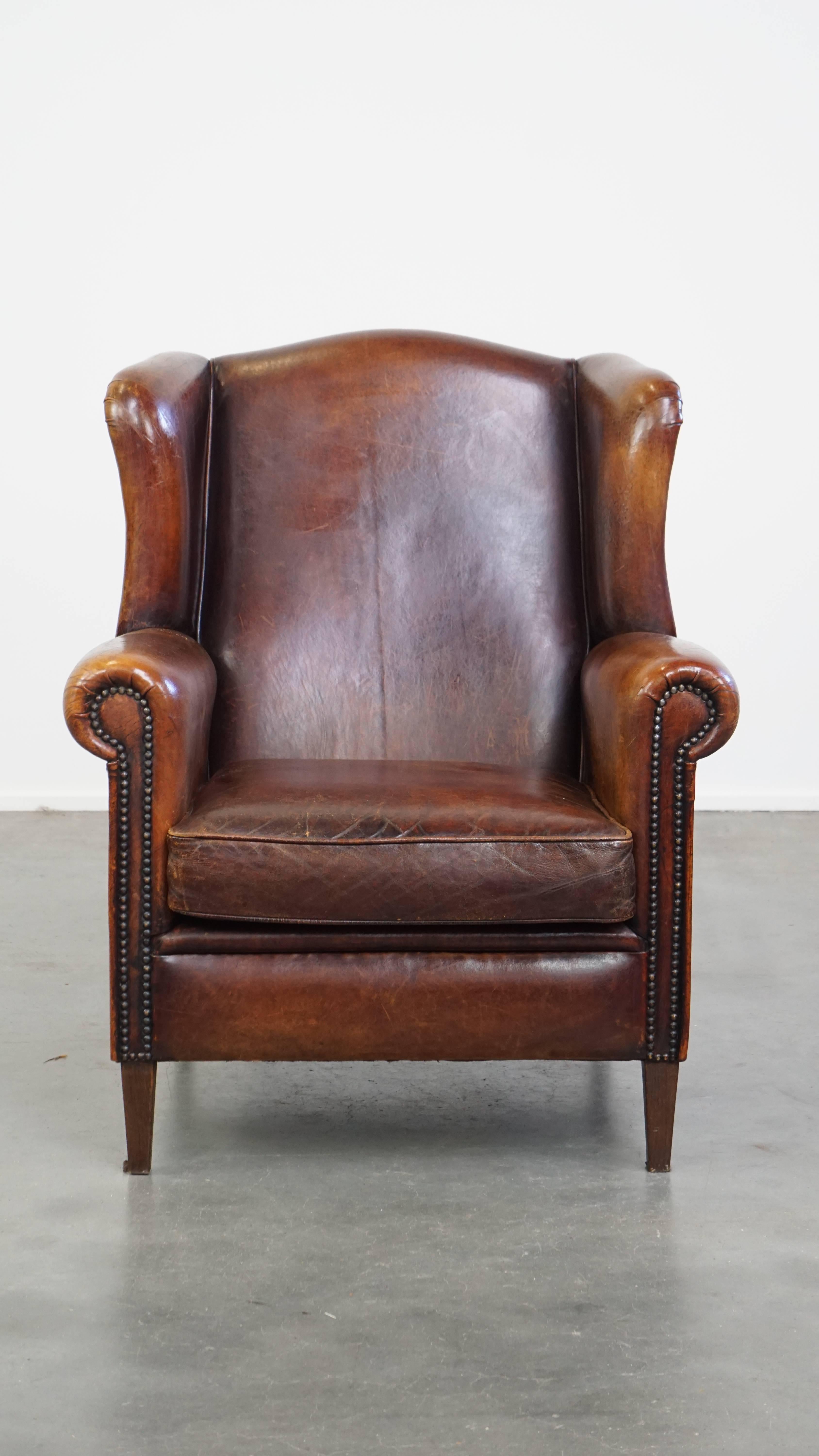 This amazing sheepskin wingback armchair is a true eye-catcher that should not be missing from any interior. It embodies timeless style and elegance.

The armchair features a beautiful color and has developed a stunning patina over the years.