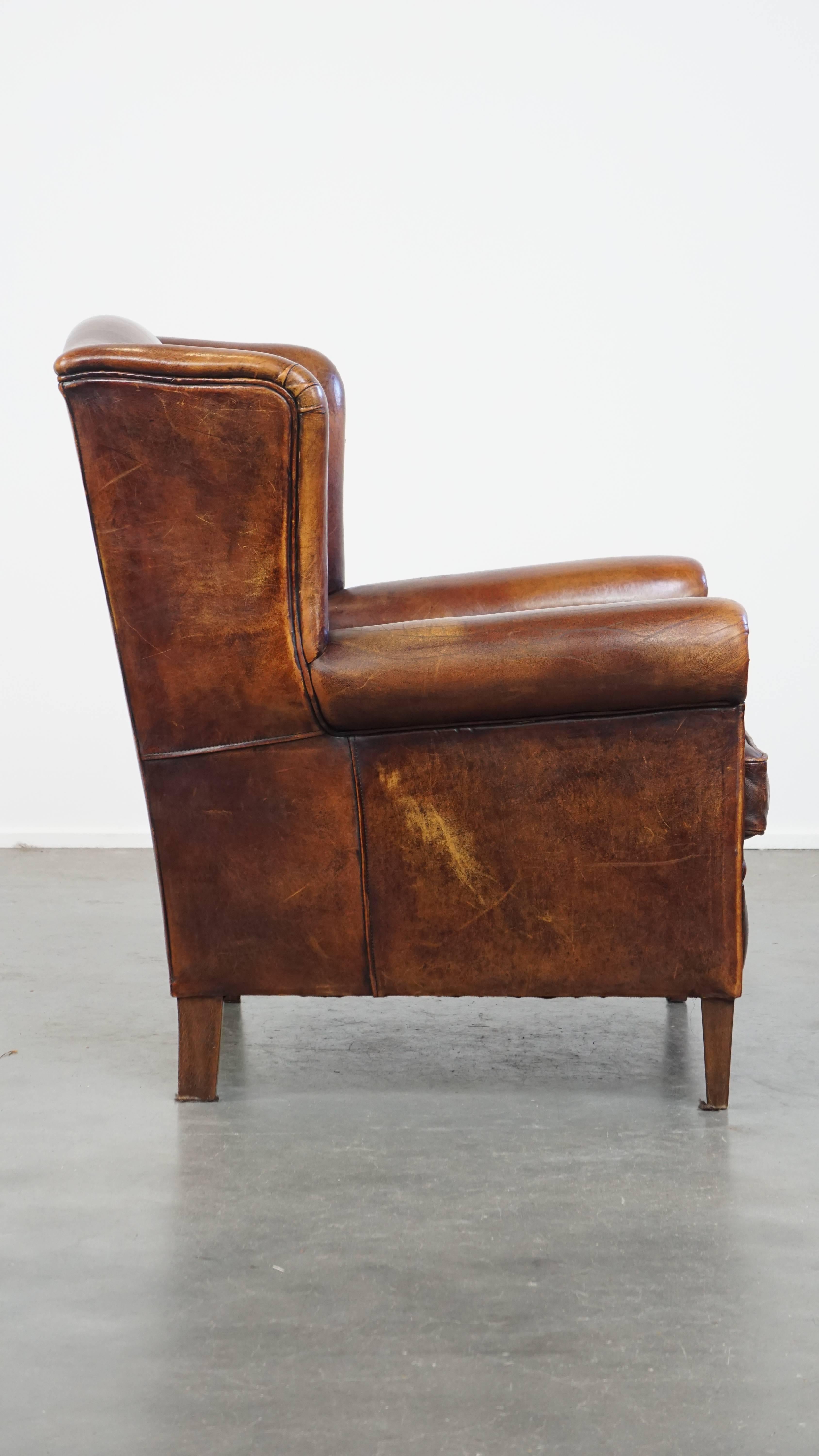 Classical Roman Comfortable Vintage Sheepskin Wingback Chair with a Beautiful Color For Sale