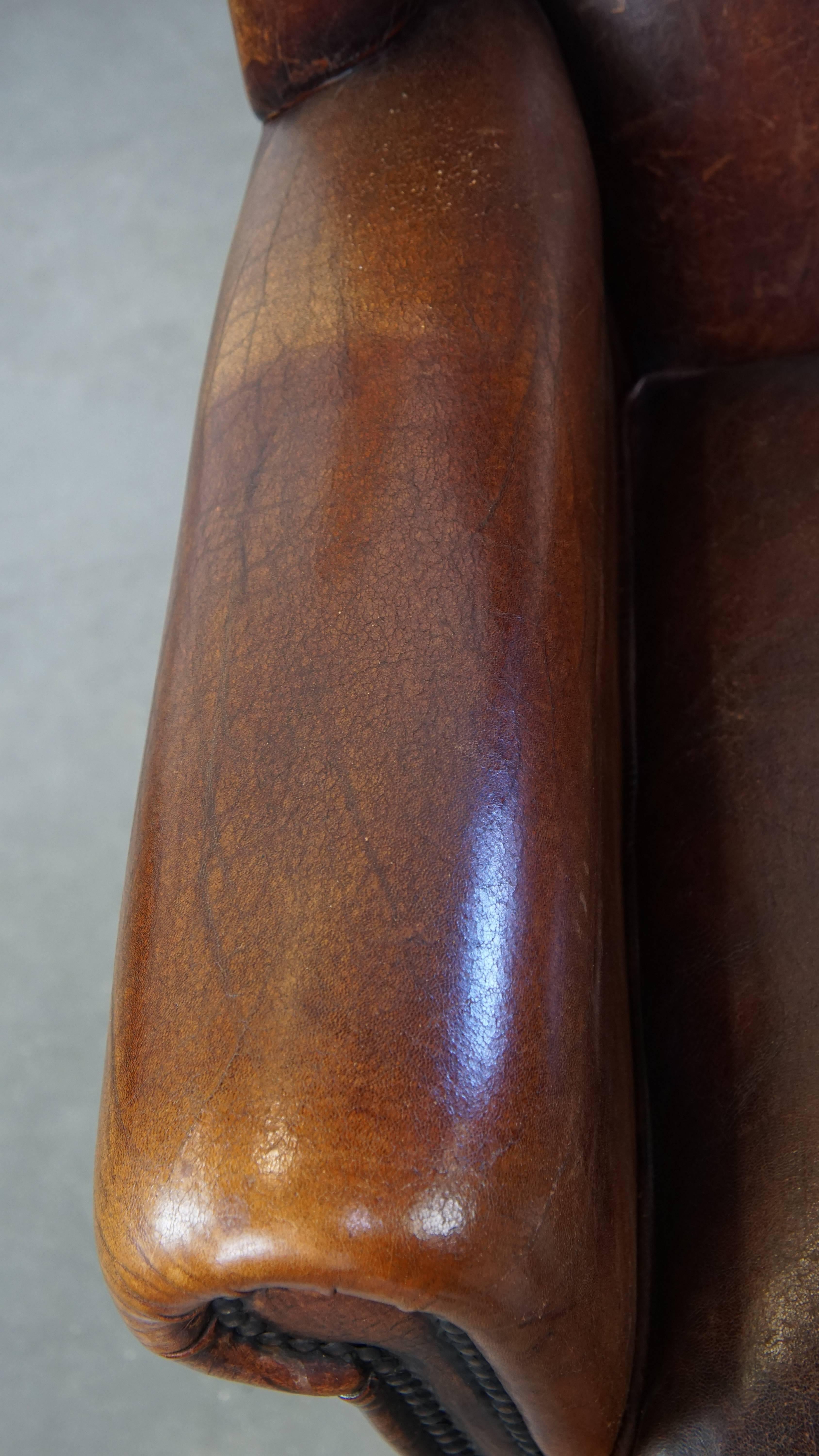 Leather Comfortable Vintage Sheepskin Wingback Chair with a Beautiful Color For Sale