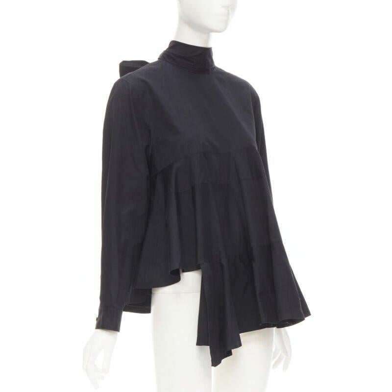 COMME DES GARCONS 1980s Vintage black asymmetric tiered flared tie back shirt M
Reference: CRTI/A00376
Brand: Comme Des Garcons
Designer: Rei Kawakubo
Material: Cotton
Color: Black
Pattern: Solid
Closure: Button
Extra Details: Button back with tie