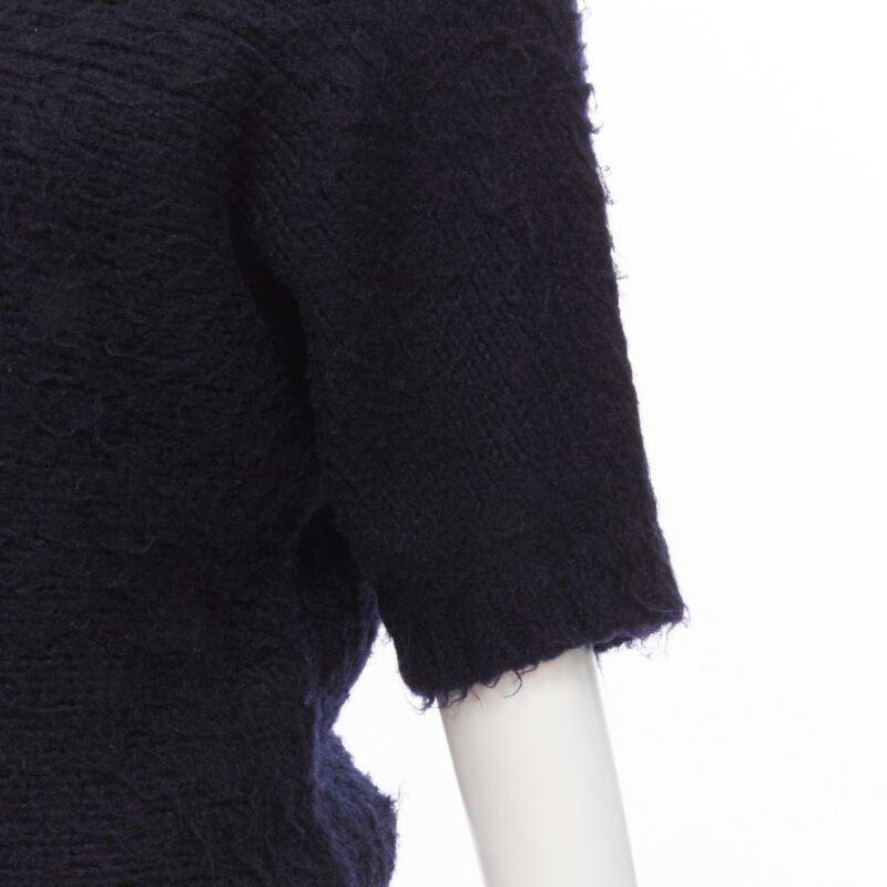 COMME DES GARCONS 1980s Vintage black boiled wool fluffy sweater M
Reference: CRTI/A00673
Brand: Comme Des Garcons
Designer: Rei Kawakubo
Collection: 1980s
Material: Wool
Color: Black
Pattern: Solid
Extra Details: Contoured knit sleeves with no