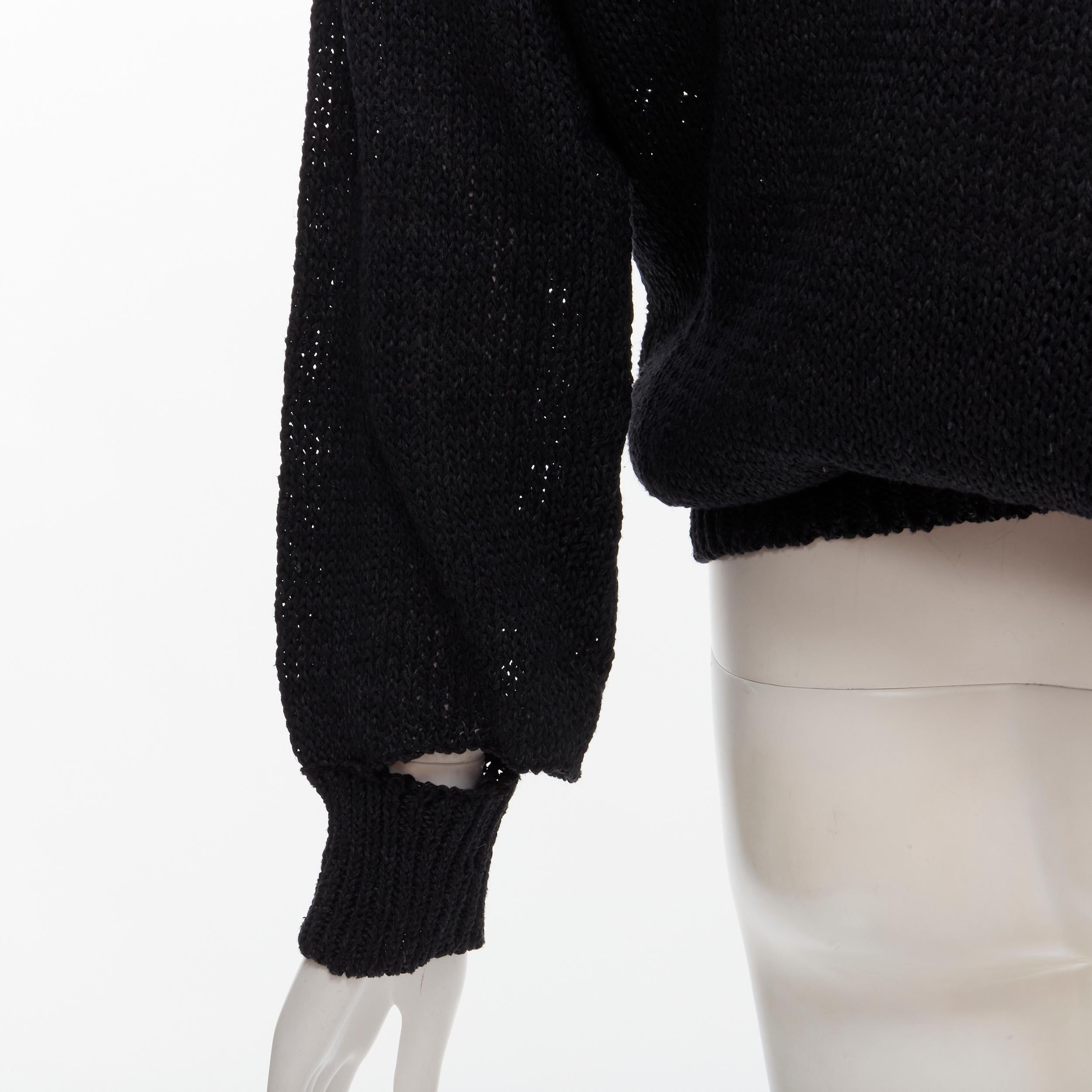 COMME DES GARCONS 1980's Vintage black coated deconstructed hem sweater M 
Reference: CRTI/A00675 
Brand: Comme Des Garcons 
Designer: Rei Kawakubo 
Collection: 1980s 
Material: Cotton 
Color: Black 
Pattern: Solid 
Extra Detail: Deconstructed