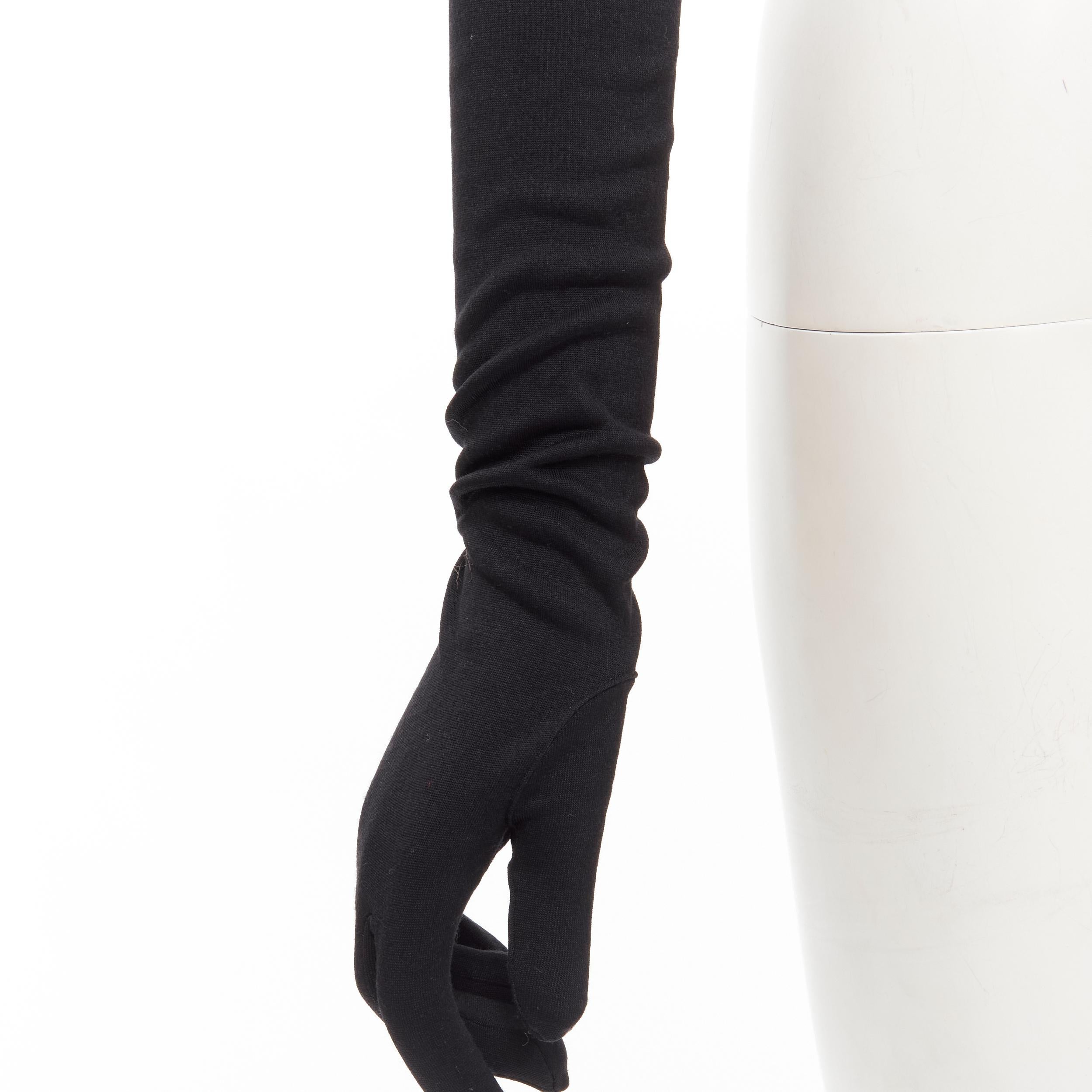 COMME DES GARCONS 1980's Vintage black velvet lined cotton opera glove 
Reference: CRTI/A00657 
Brand: Comme Des Garcons 
Designer: Rei Kawakubo 
Collection: 1980s 
Material: Cotton 
Color: Black 
Pattern: Solid 
Extra Detail: Classic opera gloves