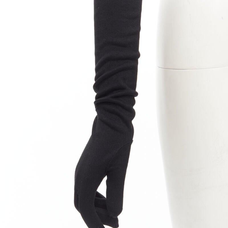 COMME DES GARCONS 1980's Vintage black velvet lined cotton opera glove
Reference: CRTI/A00657
Brand: Comme Des Garcons
Designer: Rei Kawakubo
Collection: 1980s
Material: Cotton
Color: Black
Pattern: Solid
Lining:  Velvet
Extra Details: Classic opera