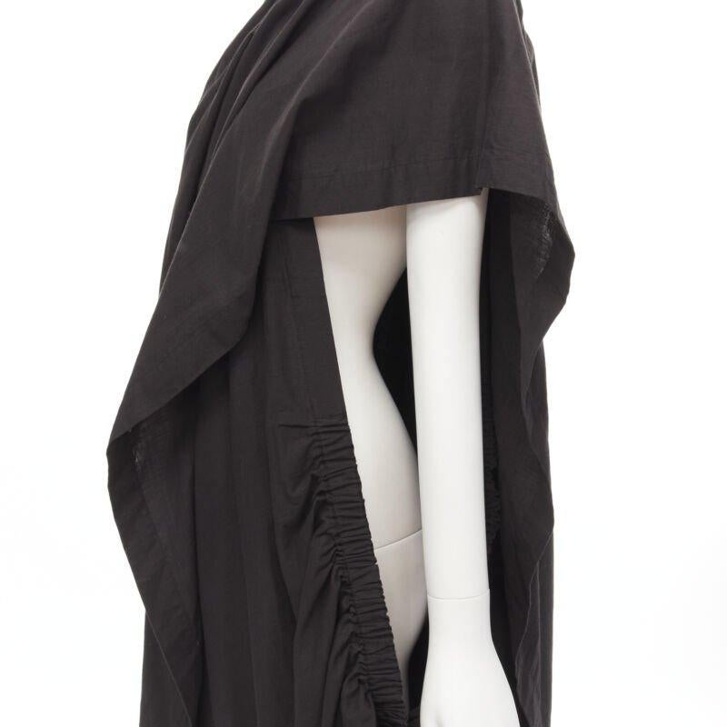 COMME DES GARCONS 1980's Vintage black washed asymmetric draped cocoon dress
Reference: CRTI/A00695
Brand: Comme Des Garcons
Designer: Rei Kawakubo
Collection: 1980s
Material: Cotton
Color: Black
Extra Details: Elasticated ruched detail. Self draped